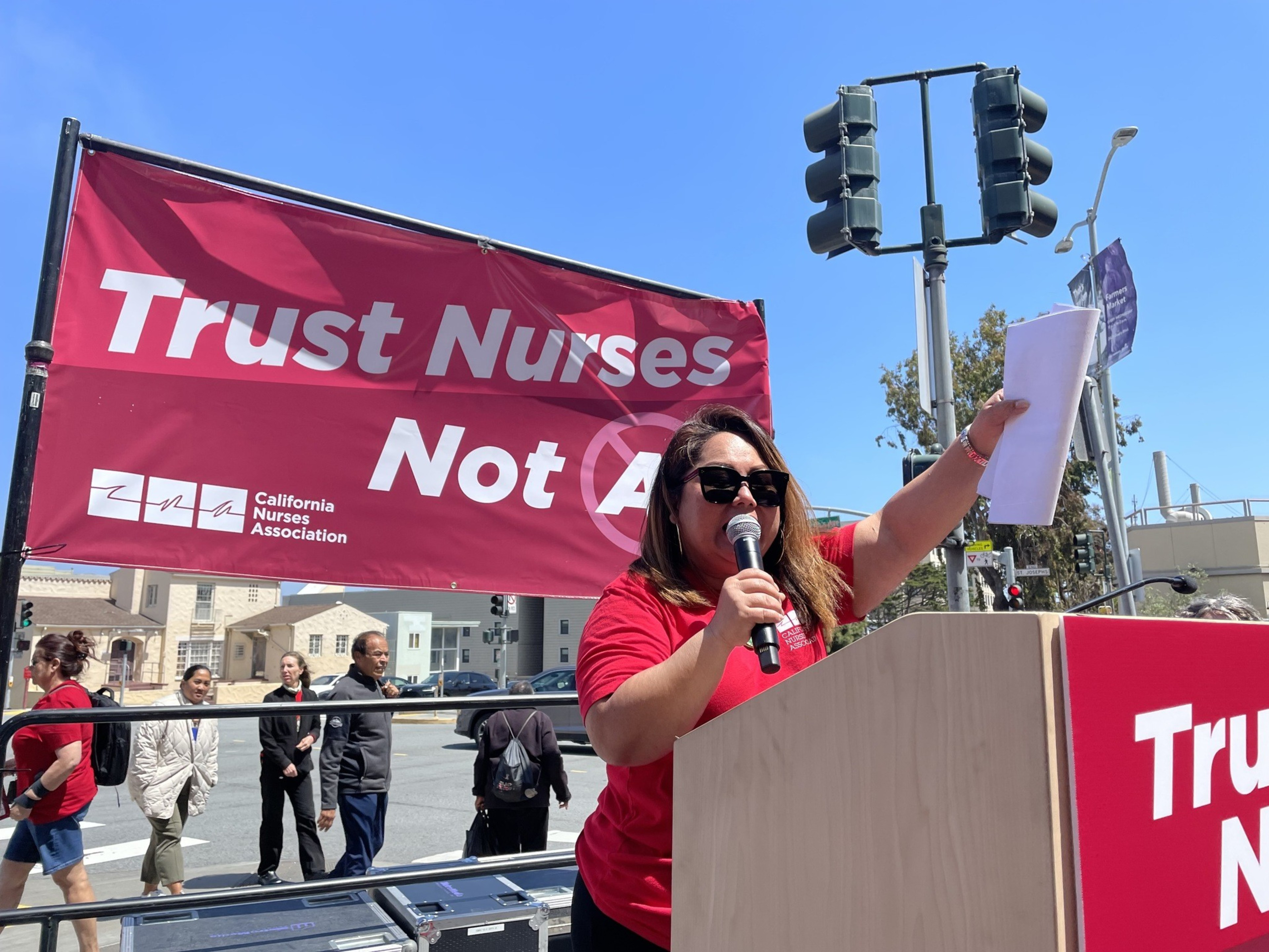 A woman speaks at a podium.