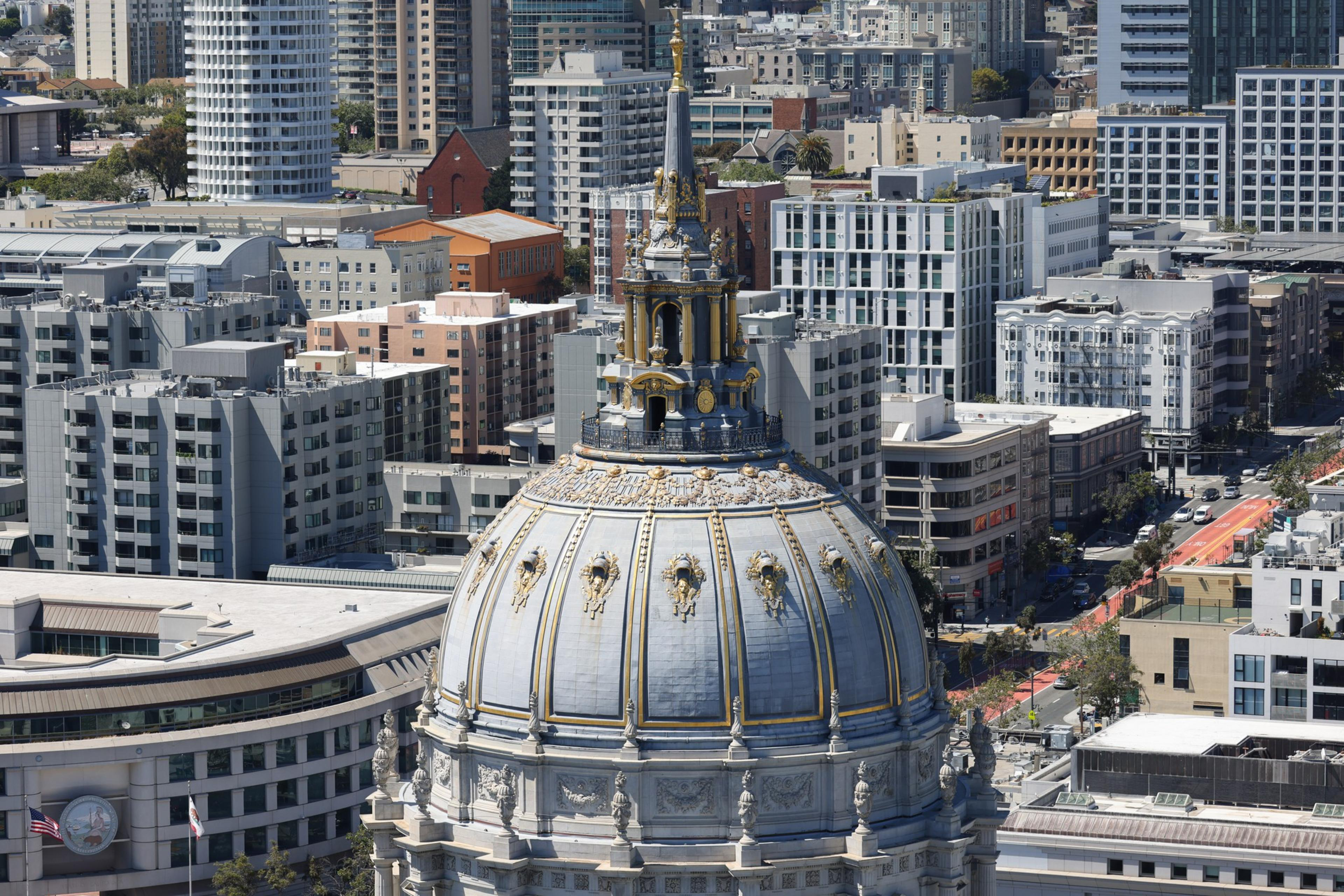 A group of 10 men attacked two men Sunday afternoon during a 12-man brawl just one block from San Francisco City Hall.