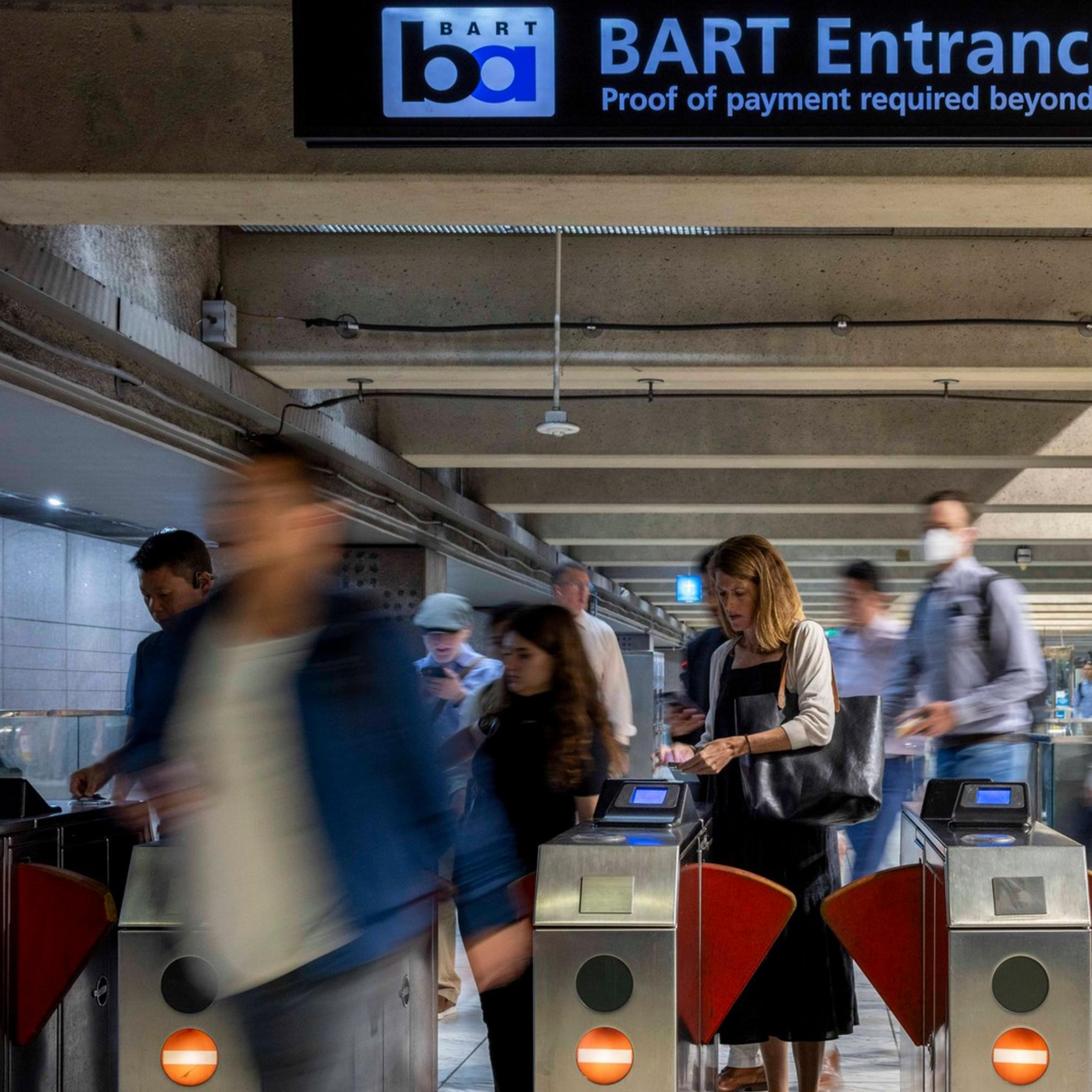 People exit the Embarcadero BART station in San Francisco.