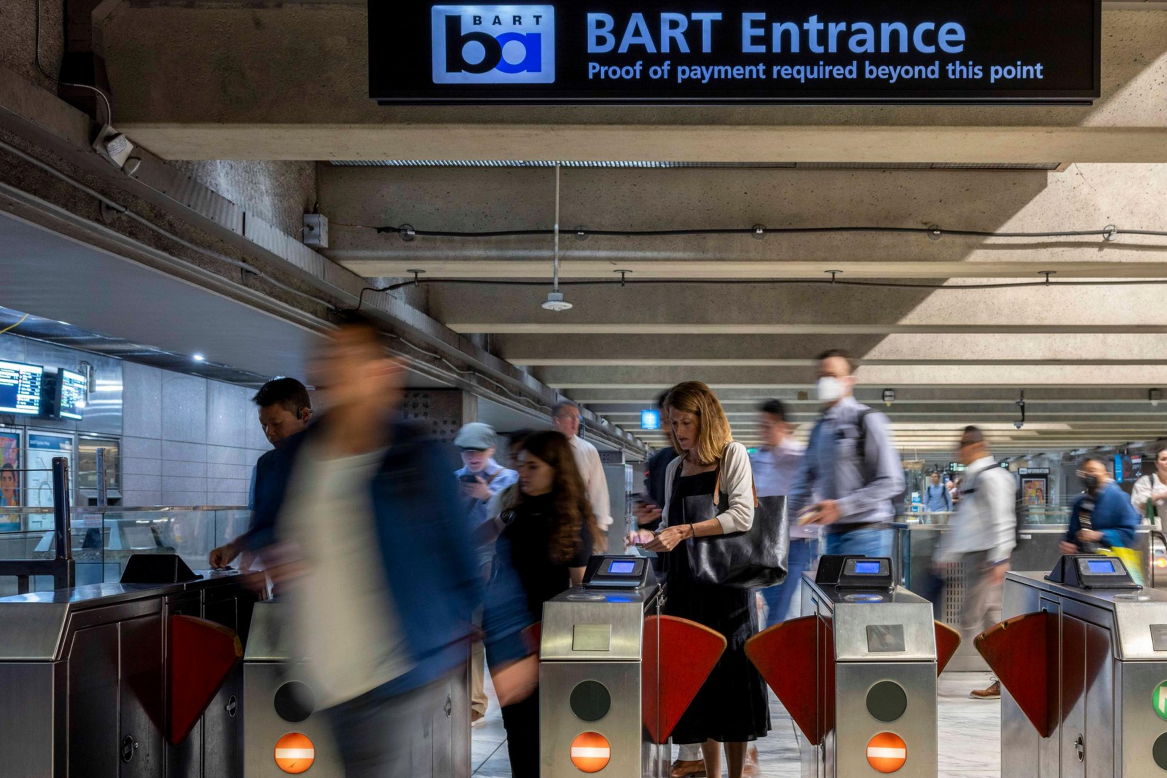 People exit the Embarcadero BART station in San Francisco.