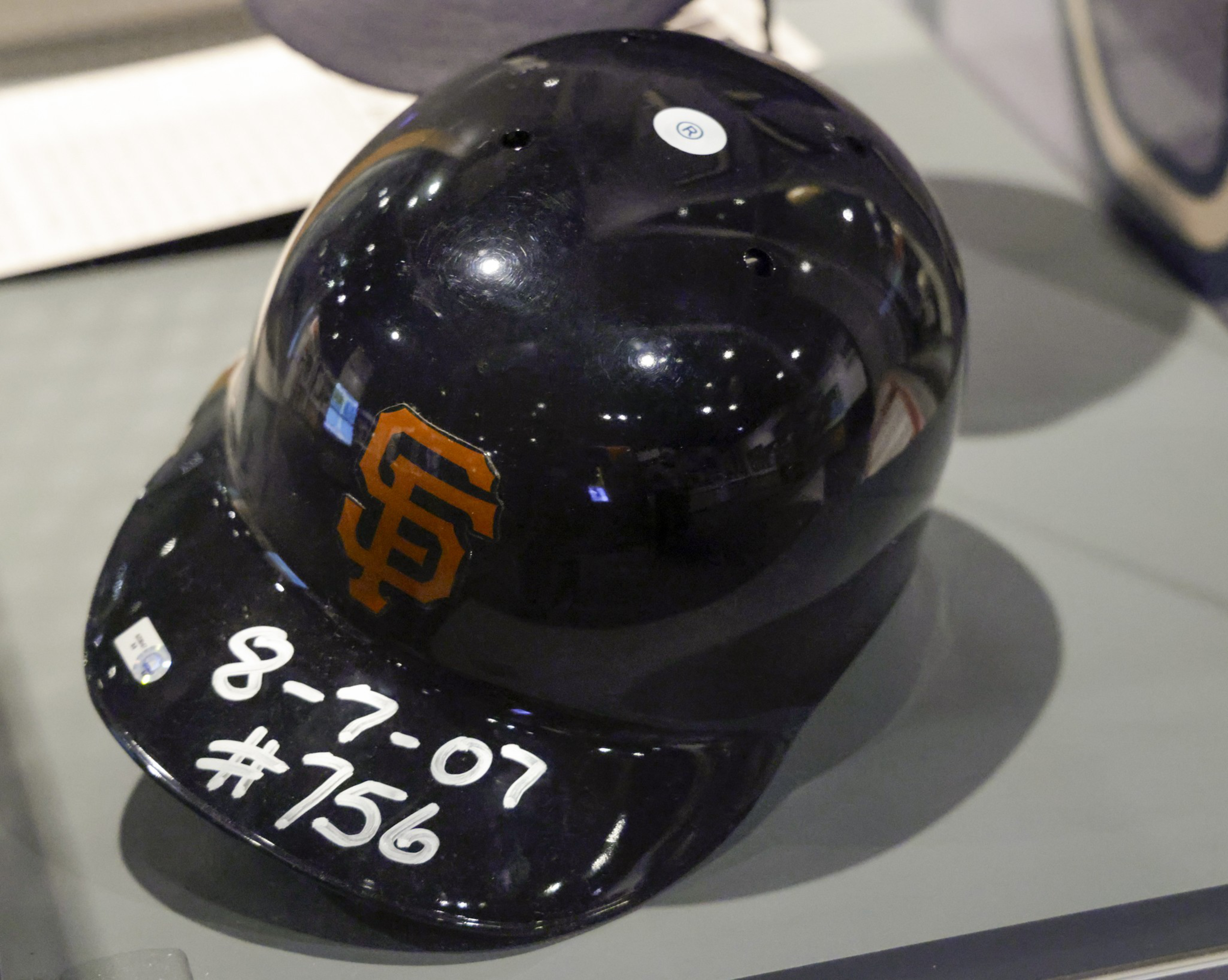 A black San Francisco Giants baseball helmet with "8-7-07 #756" written in white on the brim.