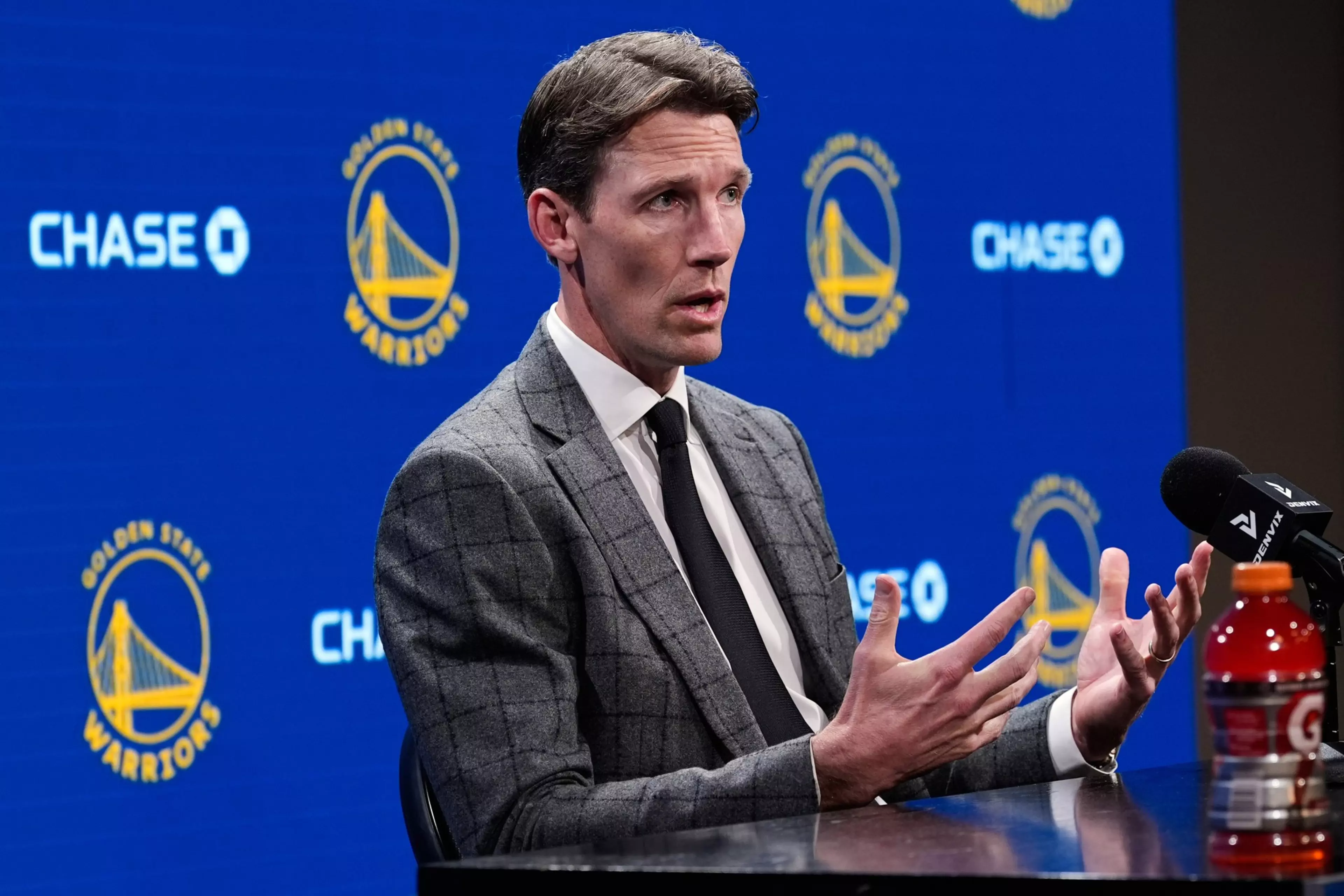 Golden State Warriors general manager Mike Dunleavy Jr. discusses team decisions at a 2026 press conference