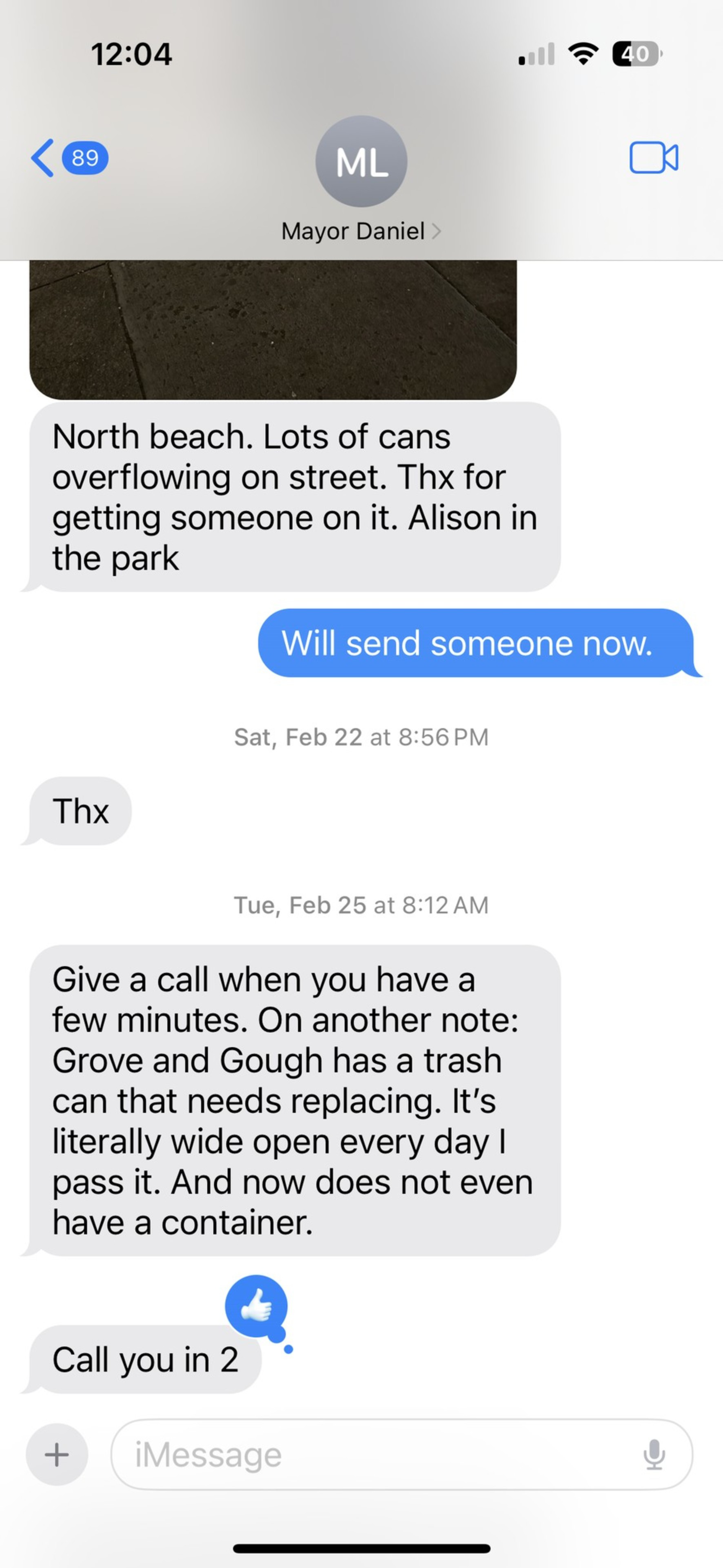 Text messages discuss overflowing trash cans at North Beach and a broken trash can at Grove and Gough, with plans to address these issues.