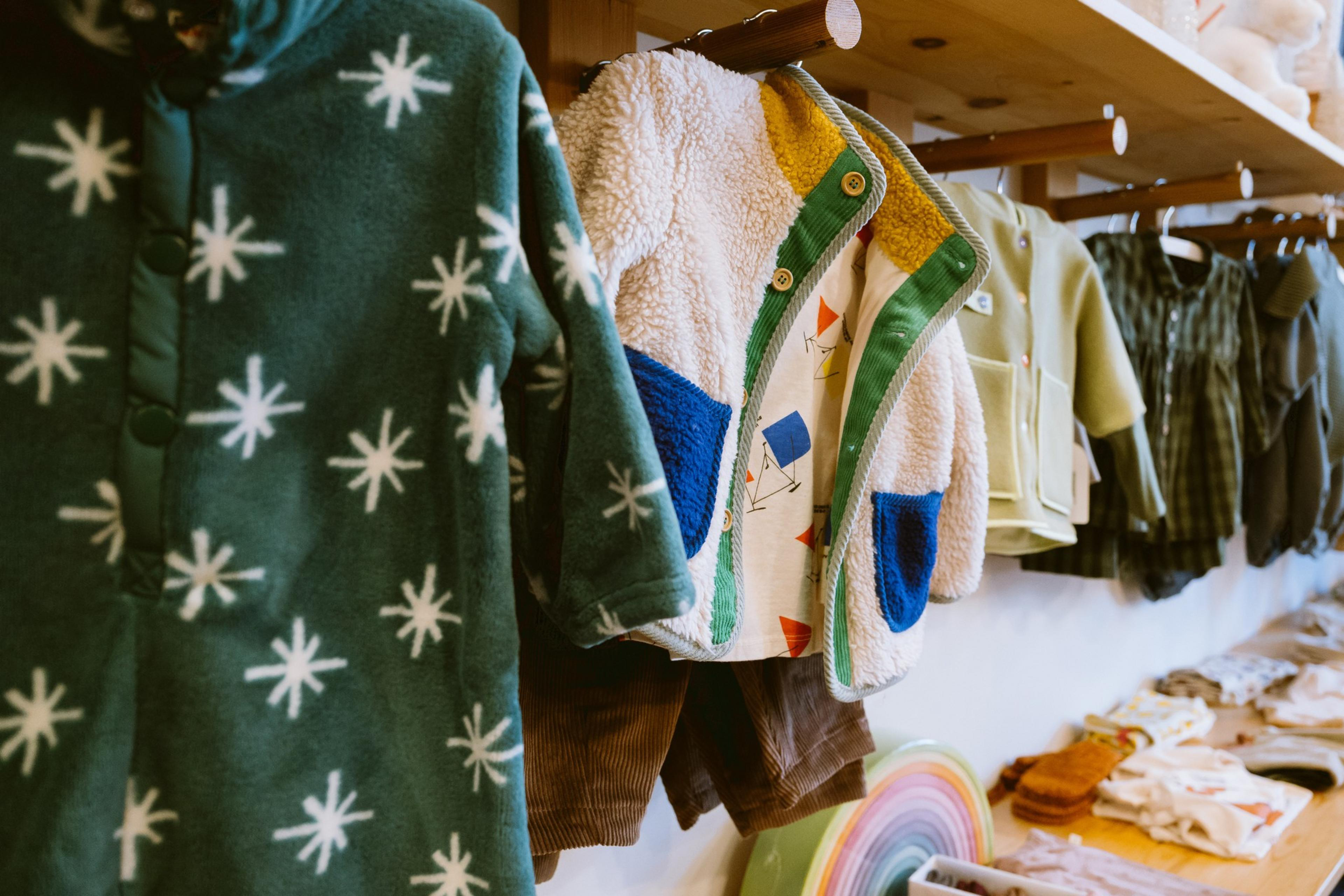 Kids clothes hang on racks at Mapamundi Kids store in the Noe Valley district in San Francisco  