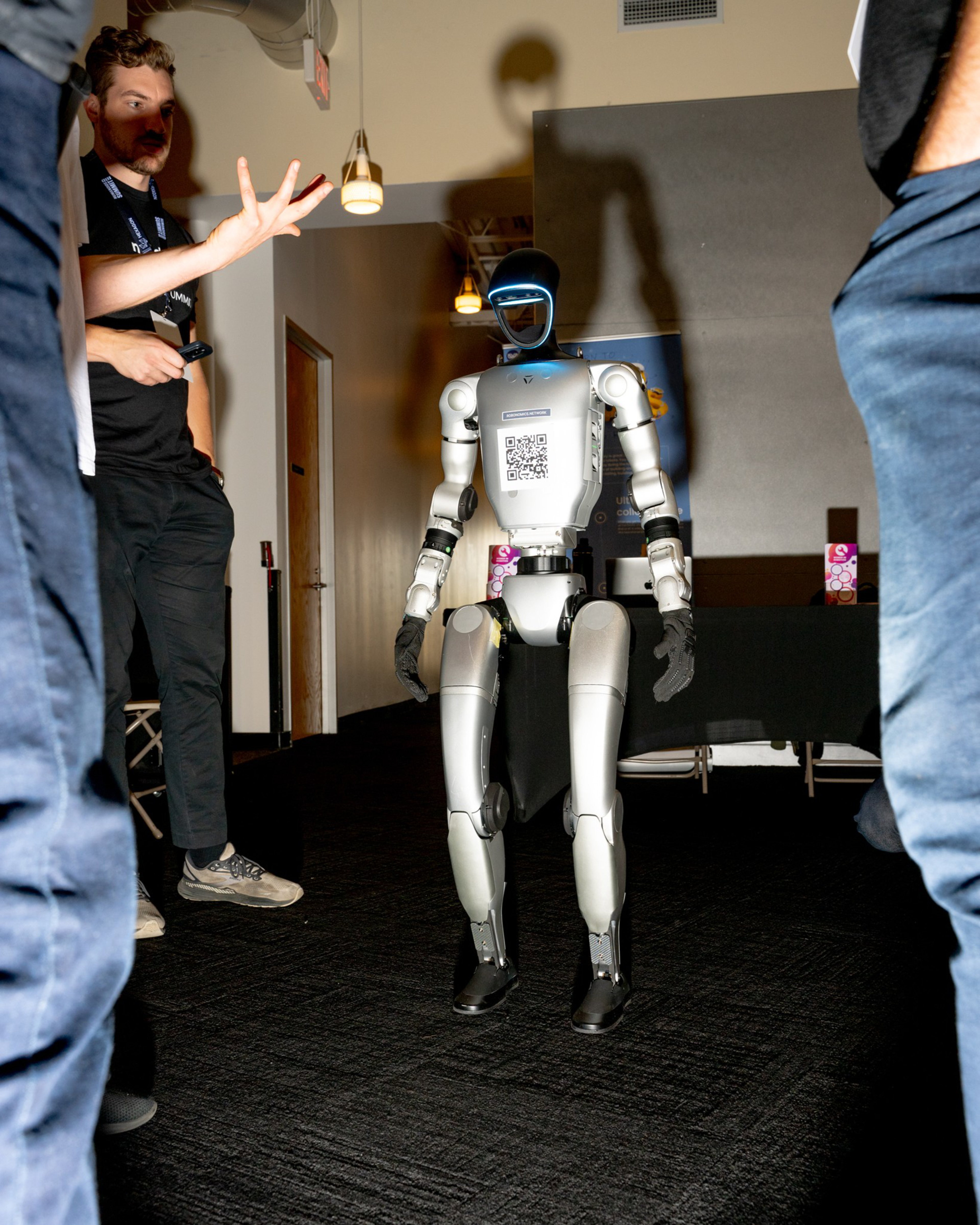 Vitaly Bulatov shows off his robot at the Humanoid Summit, hosted at the Computer Museum in Mountain View, CA on Wednesday, December 11, 2024. Vitaly wants his robot to increase the economy for Robots.