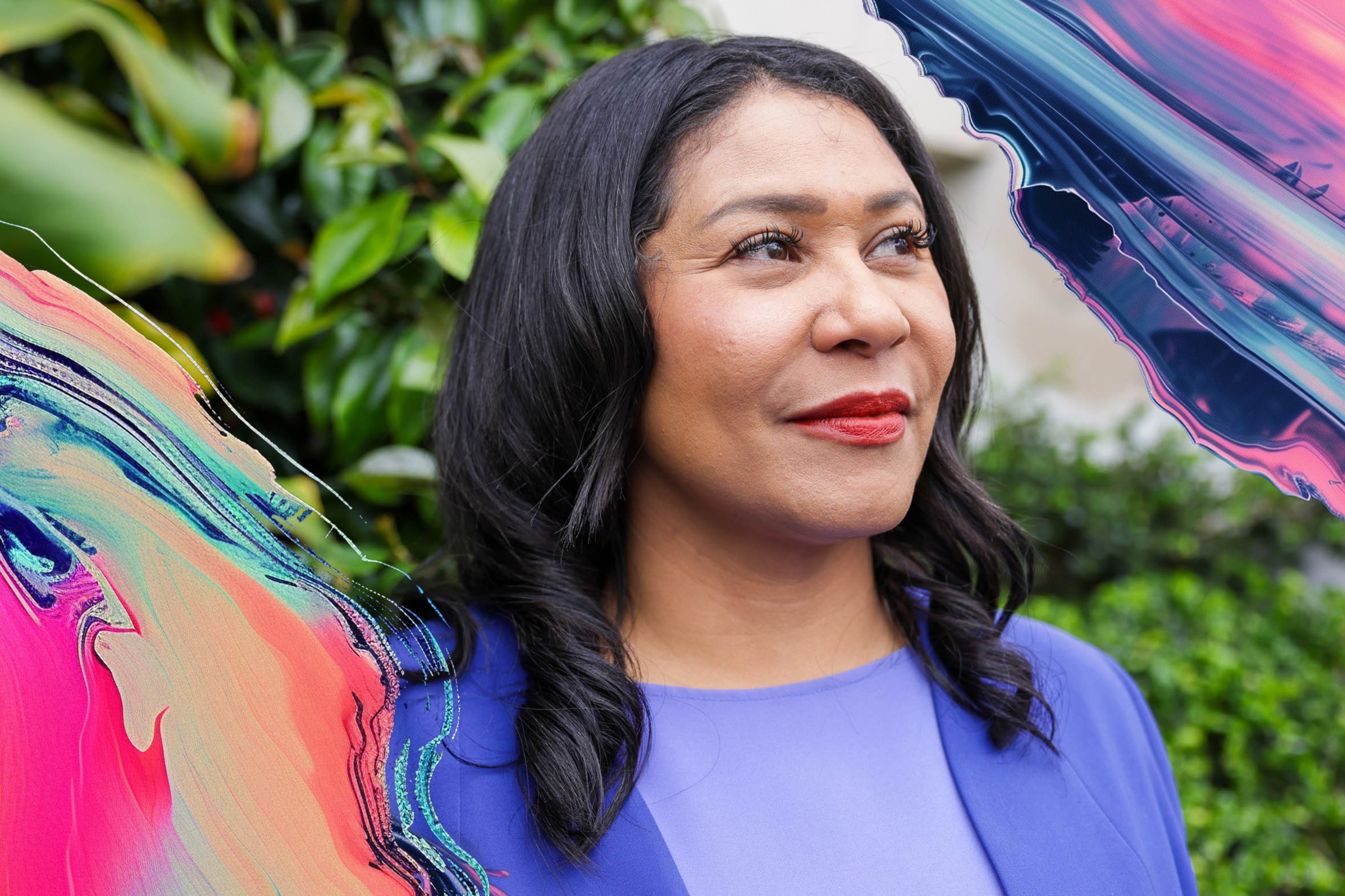 London Breed, the mayor of San Francisco, wears a purple dress in front of green foliage.
