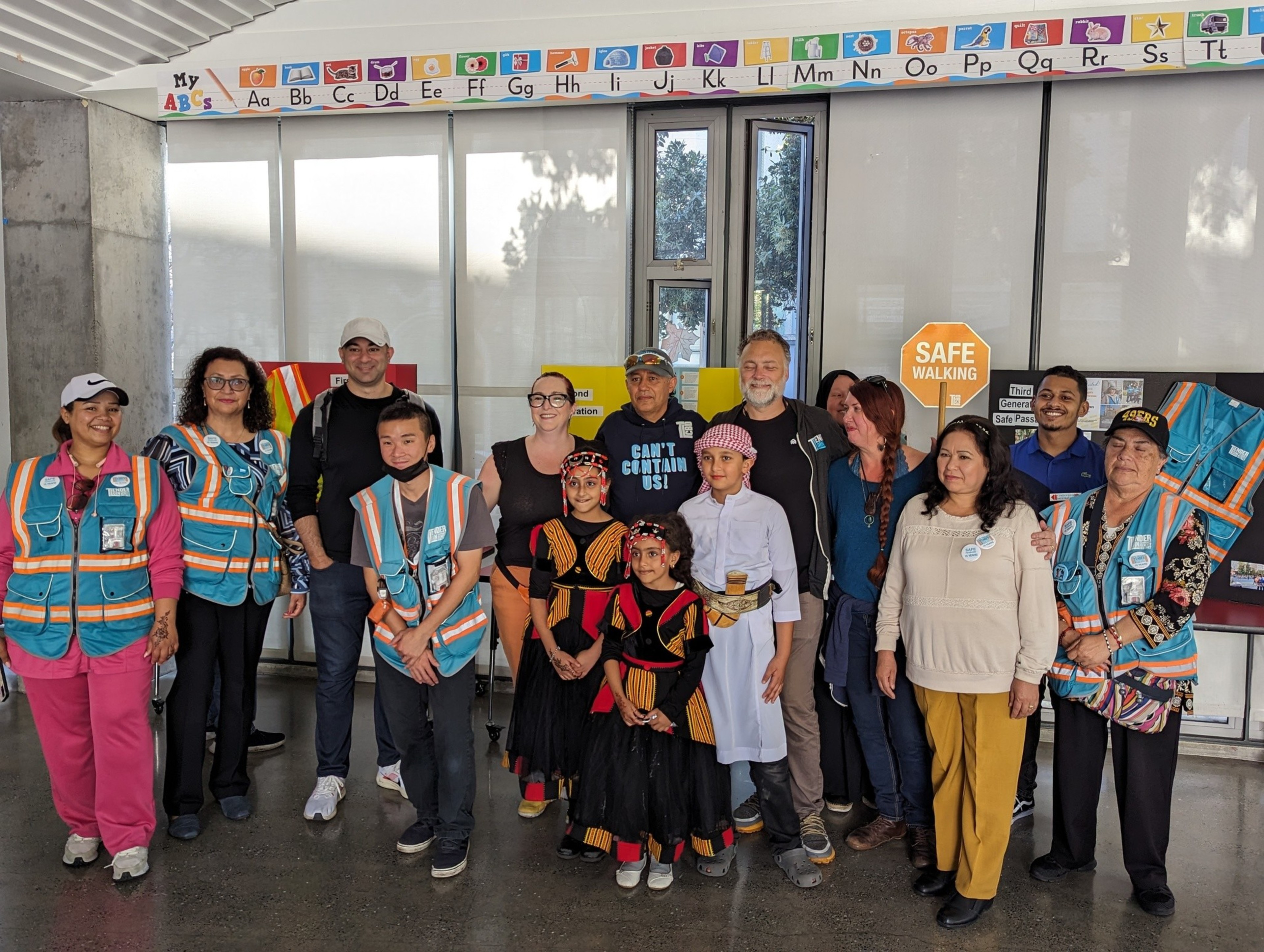 &quot;Corner captains&quot; pose alongside community members and Tenderloin Community Benefit District officials at a community gathering at Boeddeker Park's clubhouse in the city's Tenderloin neighborhood Sunday.