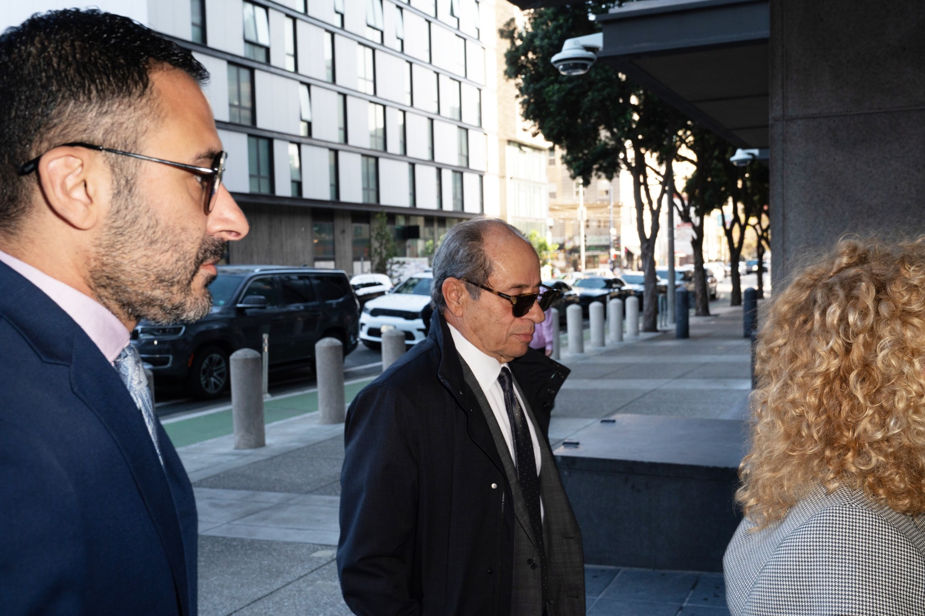 Two men walk into the federal building.