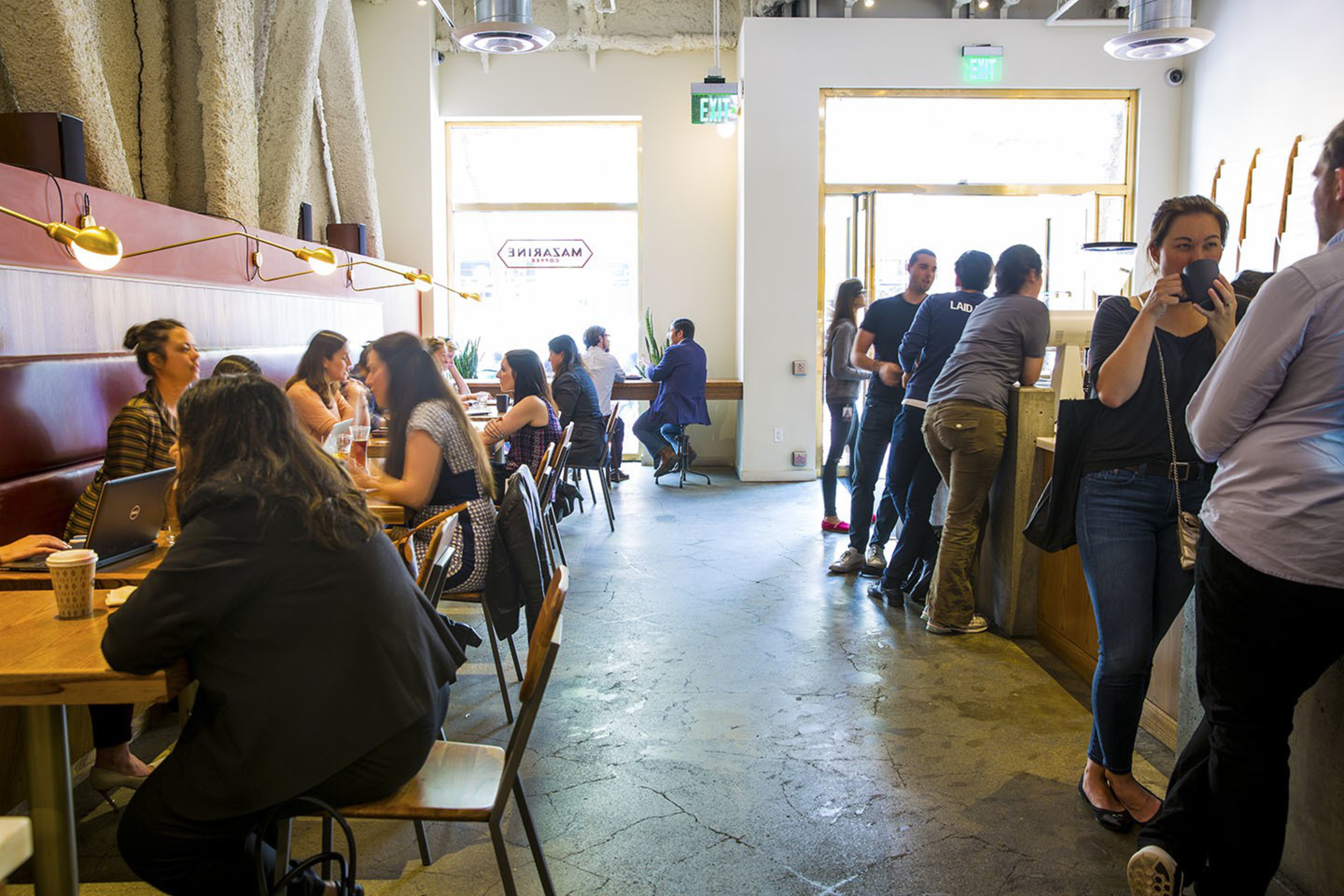 People gather inside a cafe.