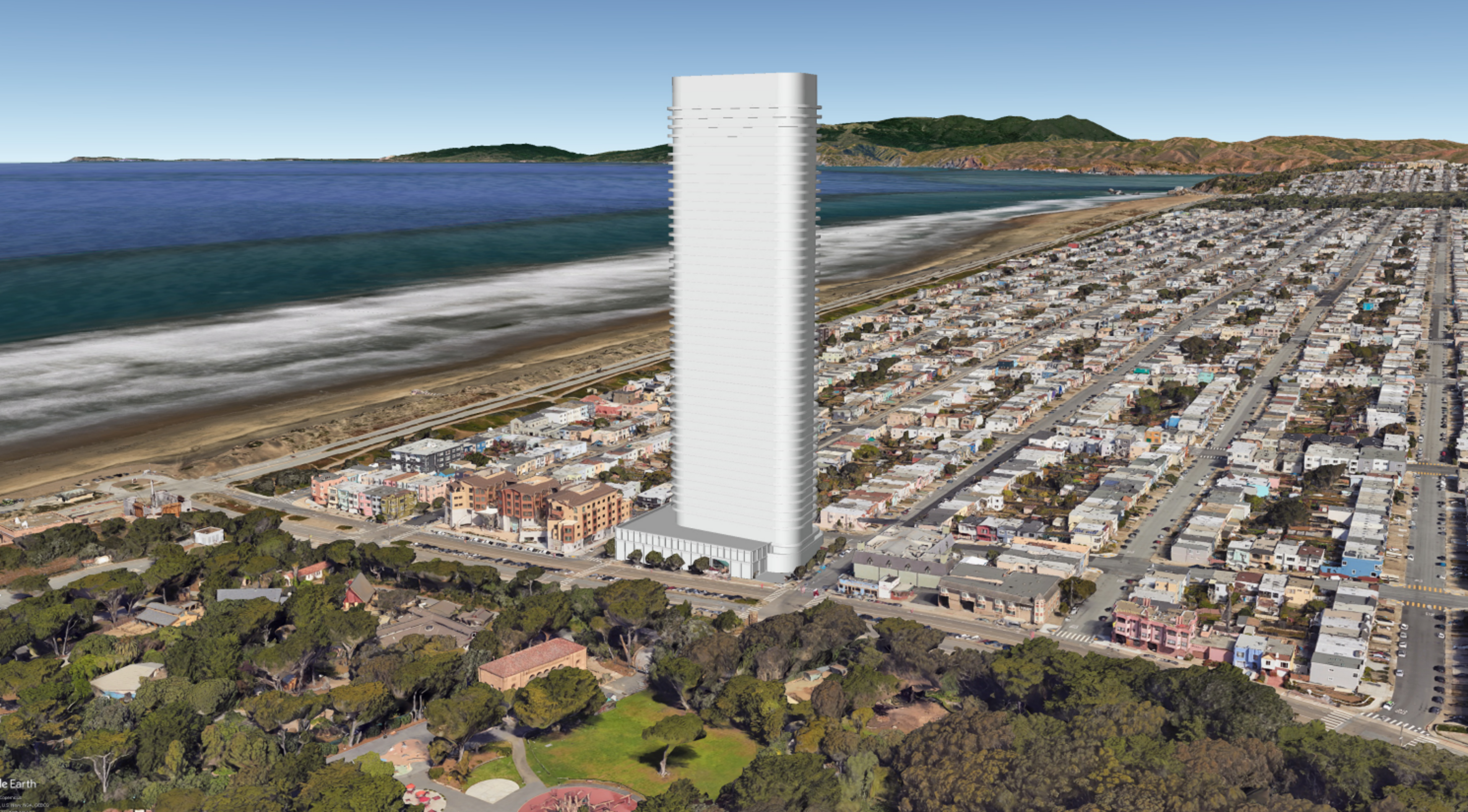 A tall, white, modern skyscraper stands amid a coastal cityscape with a beach, ocean, residential houses, and park with trees and walking paths.