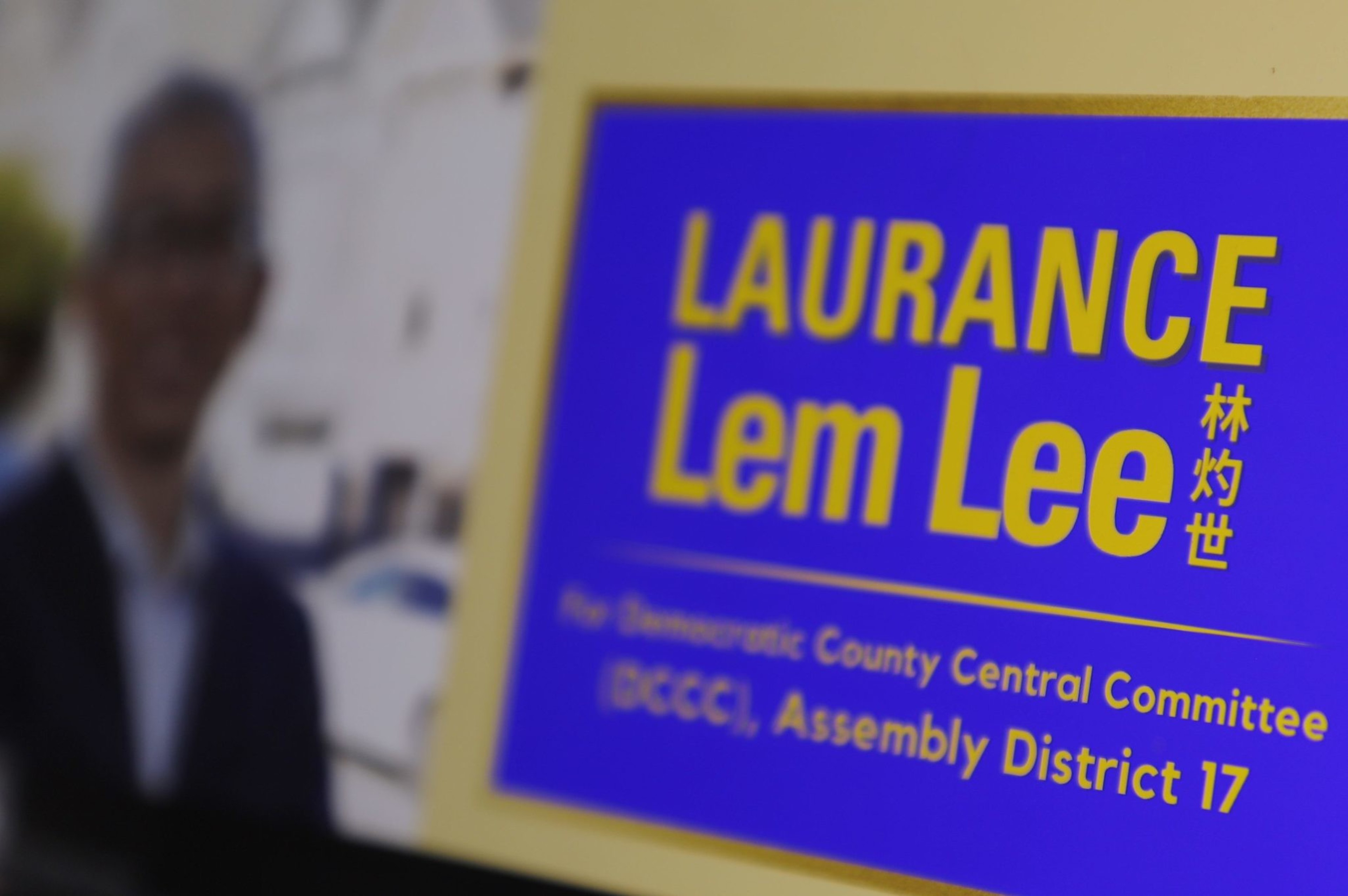 A screen shows Laurance Lem Lee's website