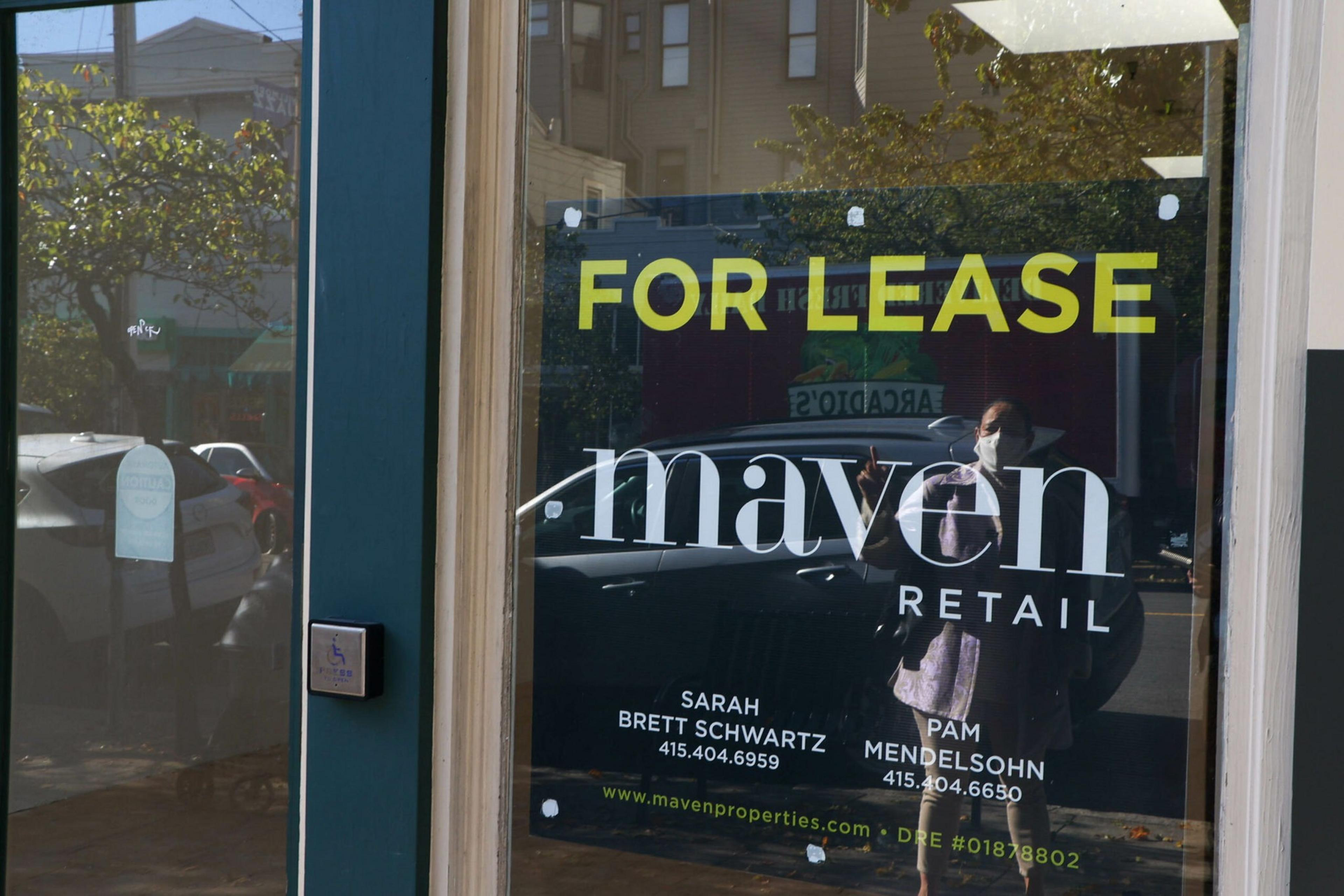 A glass door displays a "For Lease" sign by Maven Retail with contact info for Sarah Brett Schwartz and Pam Mendelsohn, including phone numbers.
