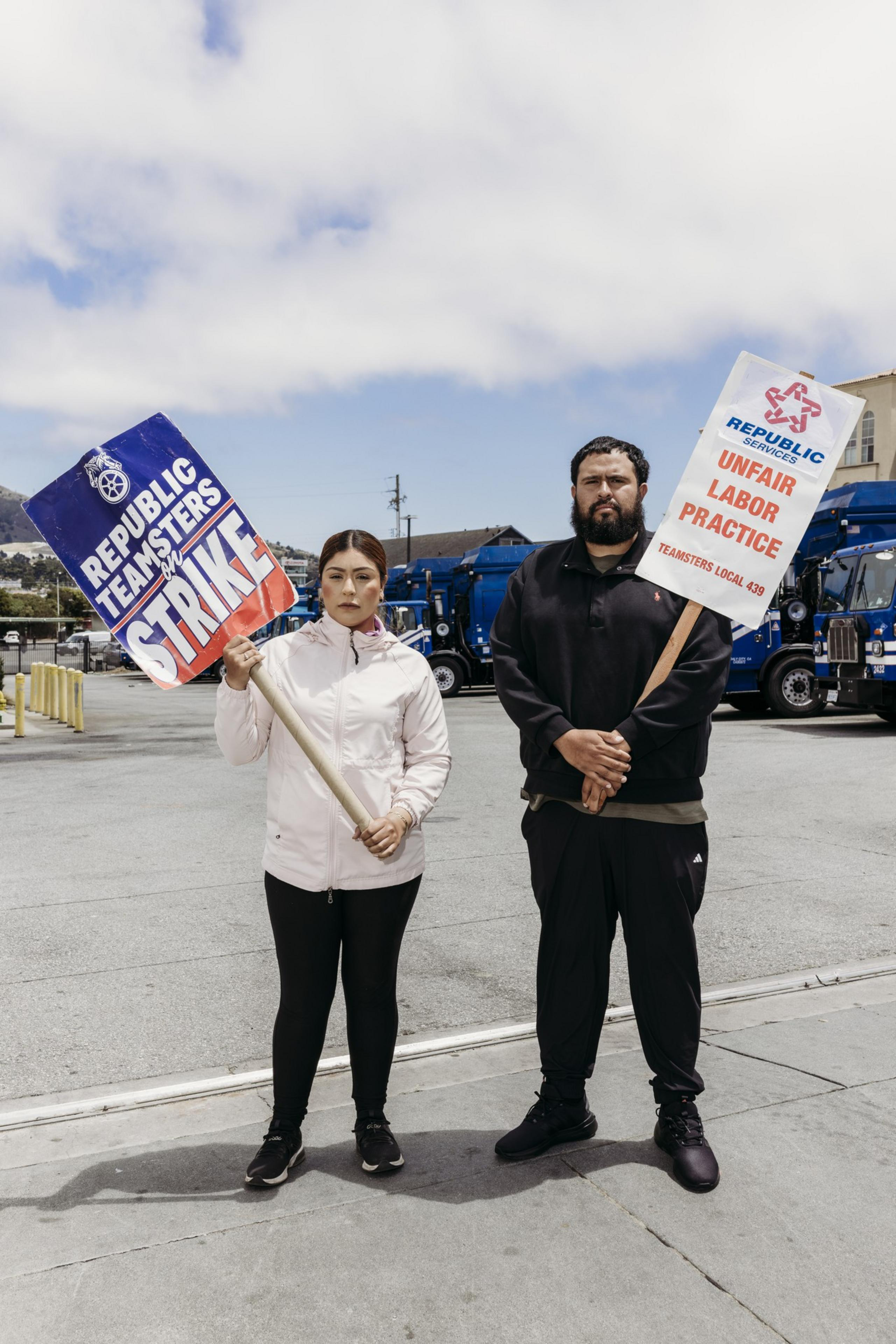 Two people hold strike signs outside, with trucks in the background. The signs mention “Republic Teamsters,” “Unfair Labor Practice,” and “Strike.”
