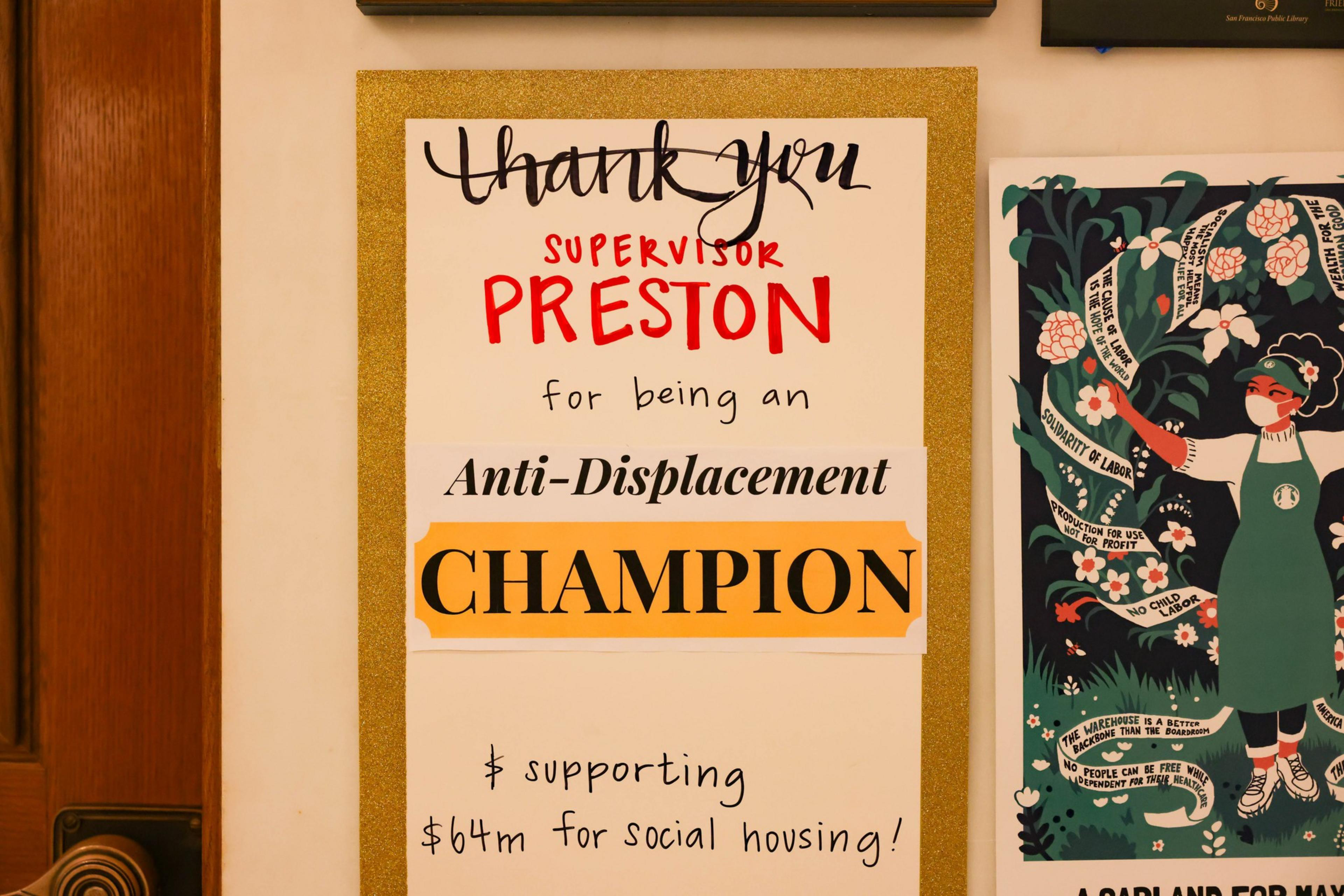 a sign in various colors and fonts thanks an elected official for helping people remain in their homes