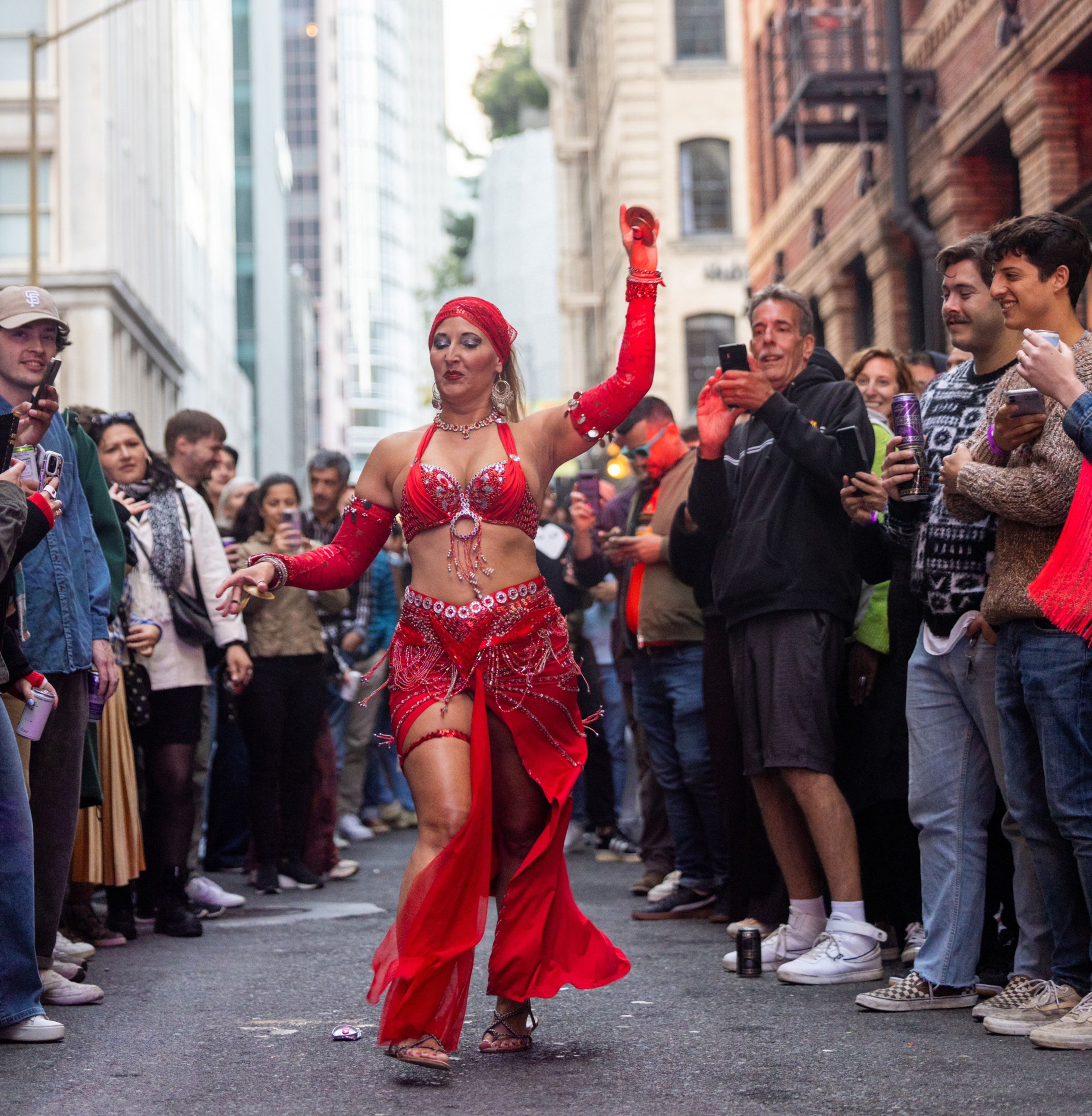 A performer dances in front of a crowd. 