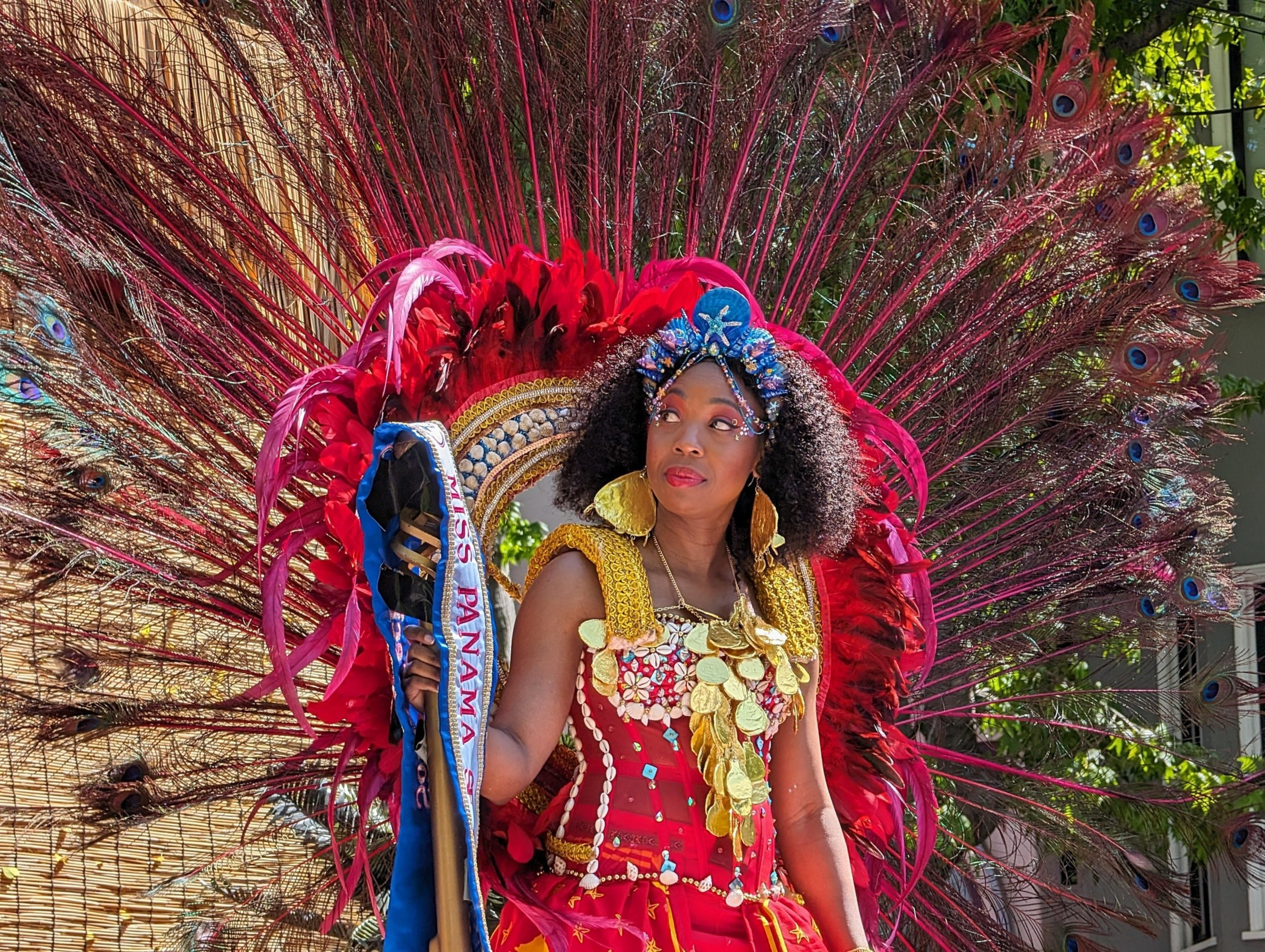 A colorful boat-laden float awaits a parade's start