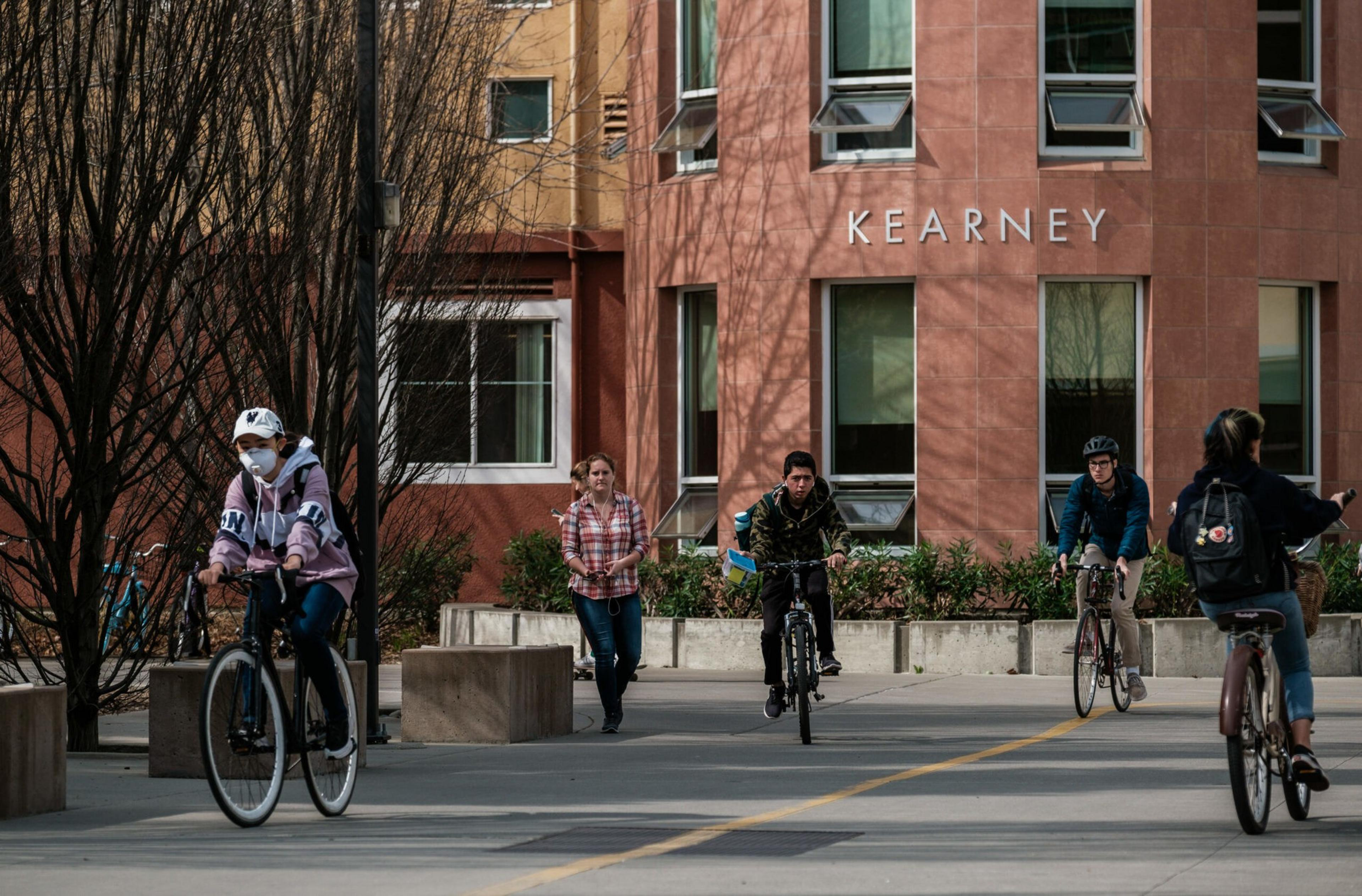 Students cycle on the campus of UC Davis. | Nick Otto/Washington Post via Getty Images