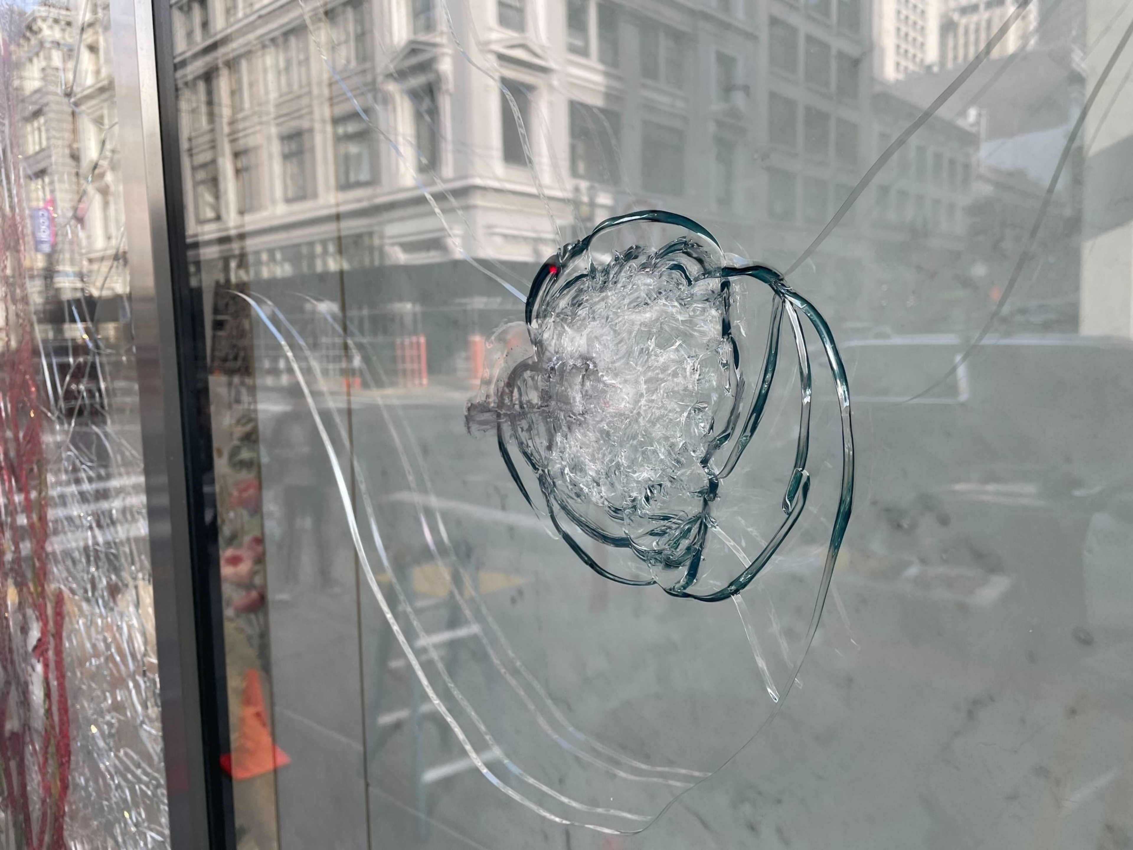 A window with what appears to be a bullet hole