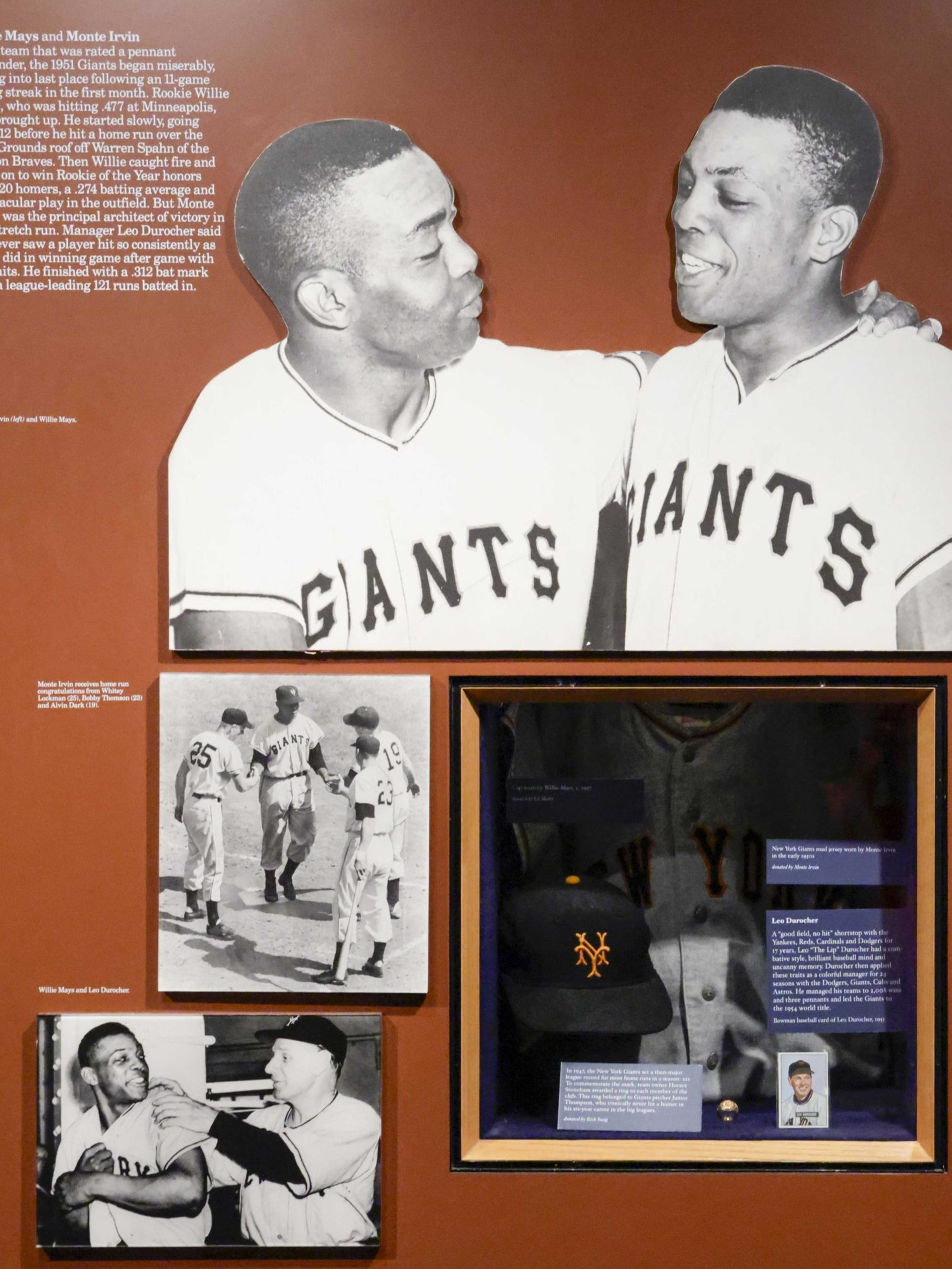 The image displays black-and-white photos of baseball players in &quot;Giants&quot; uniforms, a framed jersey and cap, and text detailing their achievements.