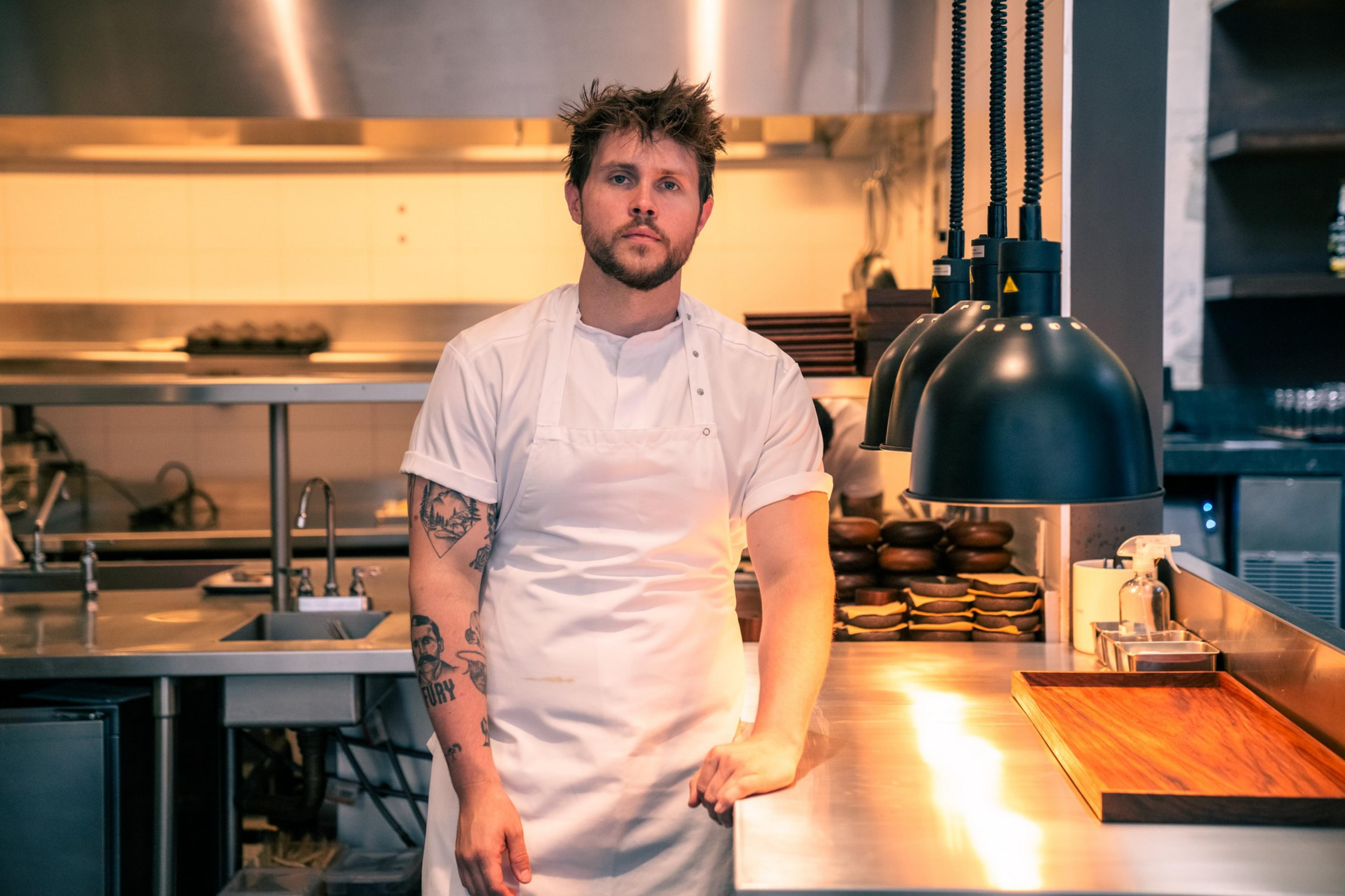 John Wesley, former Sons &amp; Daughters chef, poses for a portrait in his kitchen at Kiln. 