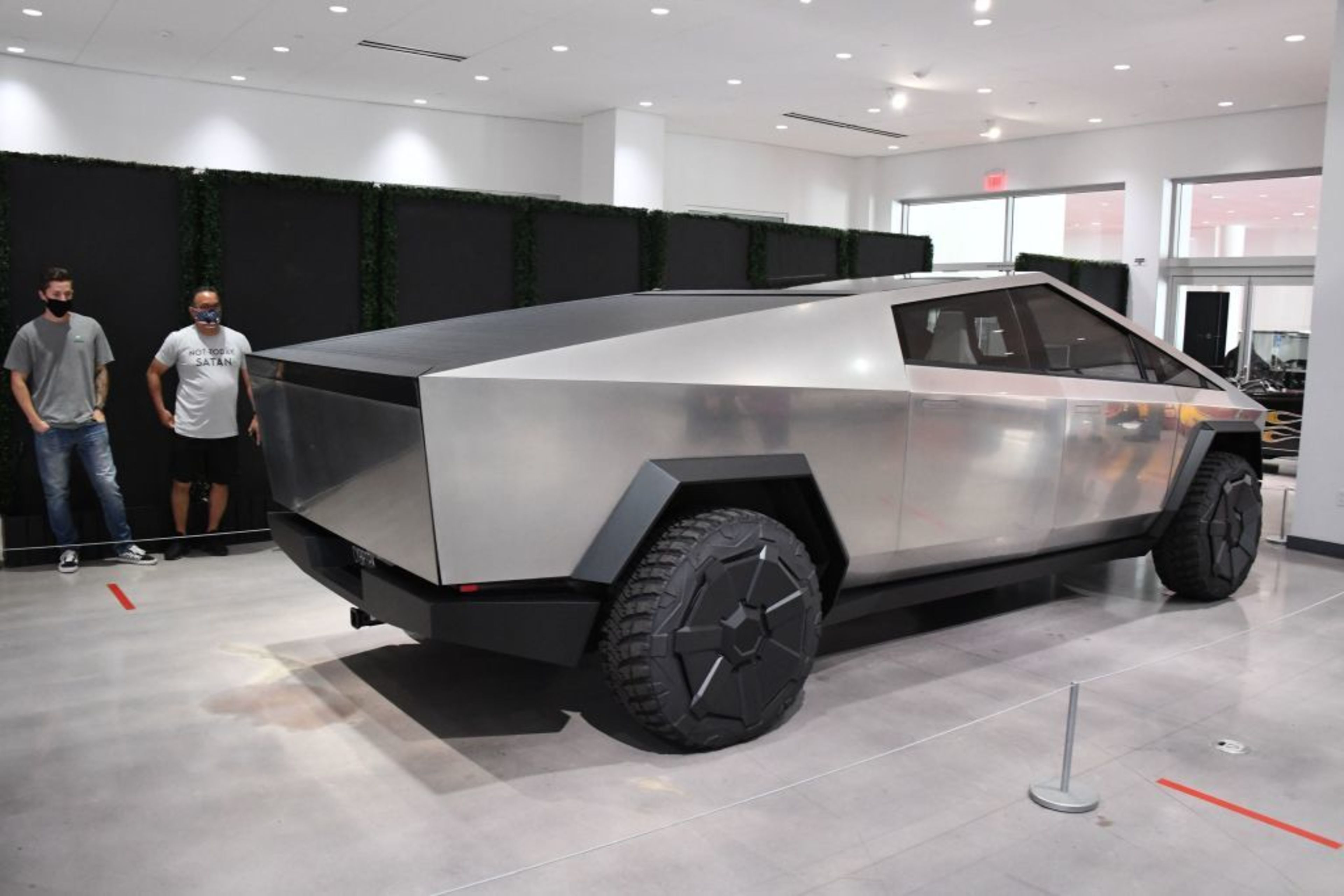 a cybertruck is seen in a showroom