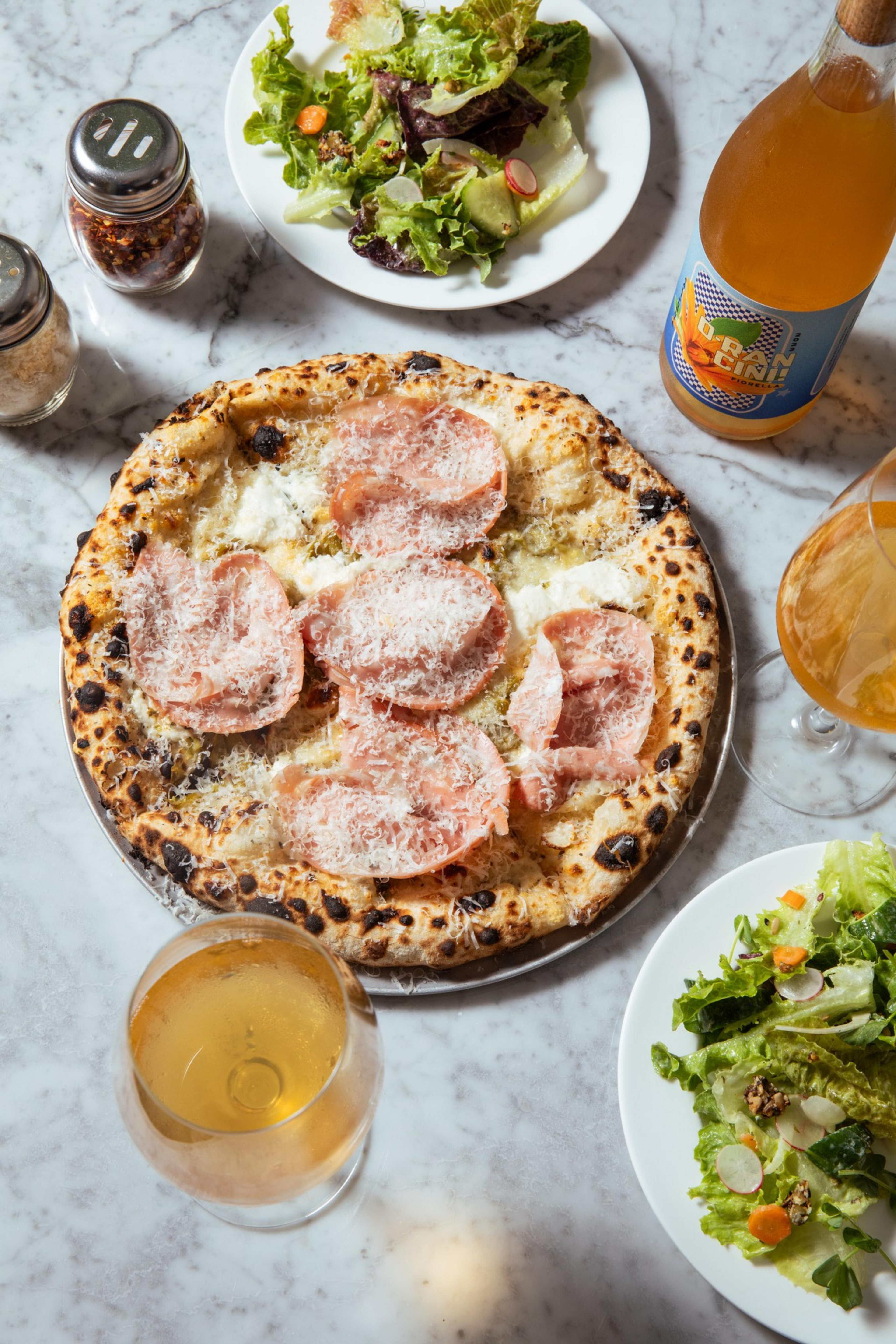 The Spicy Florence pie with an additional mortadella gets its heat from the green Italian hot peppers that Fiorella has grown specifically for their kitchen.