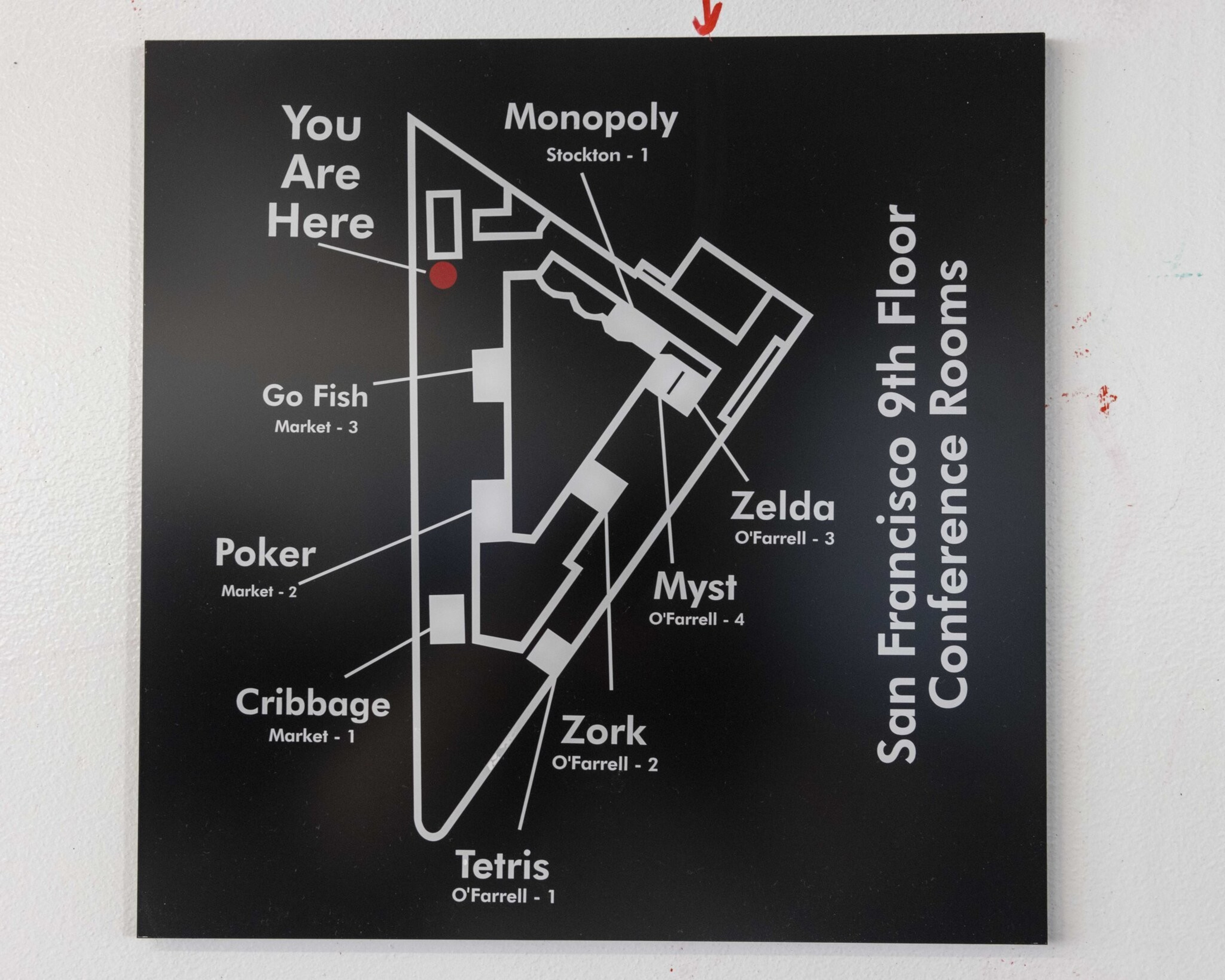 The image shows a map of the San Francisco 9th Floor Conference Rooms labeled with names like Monopoly, Zelda, Tetris, Go Fish, and more, and a &quot;You Are Here&quot; marker.