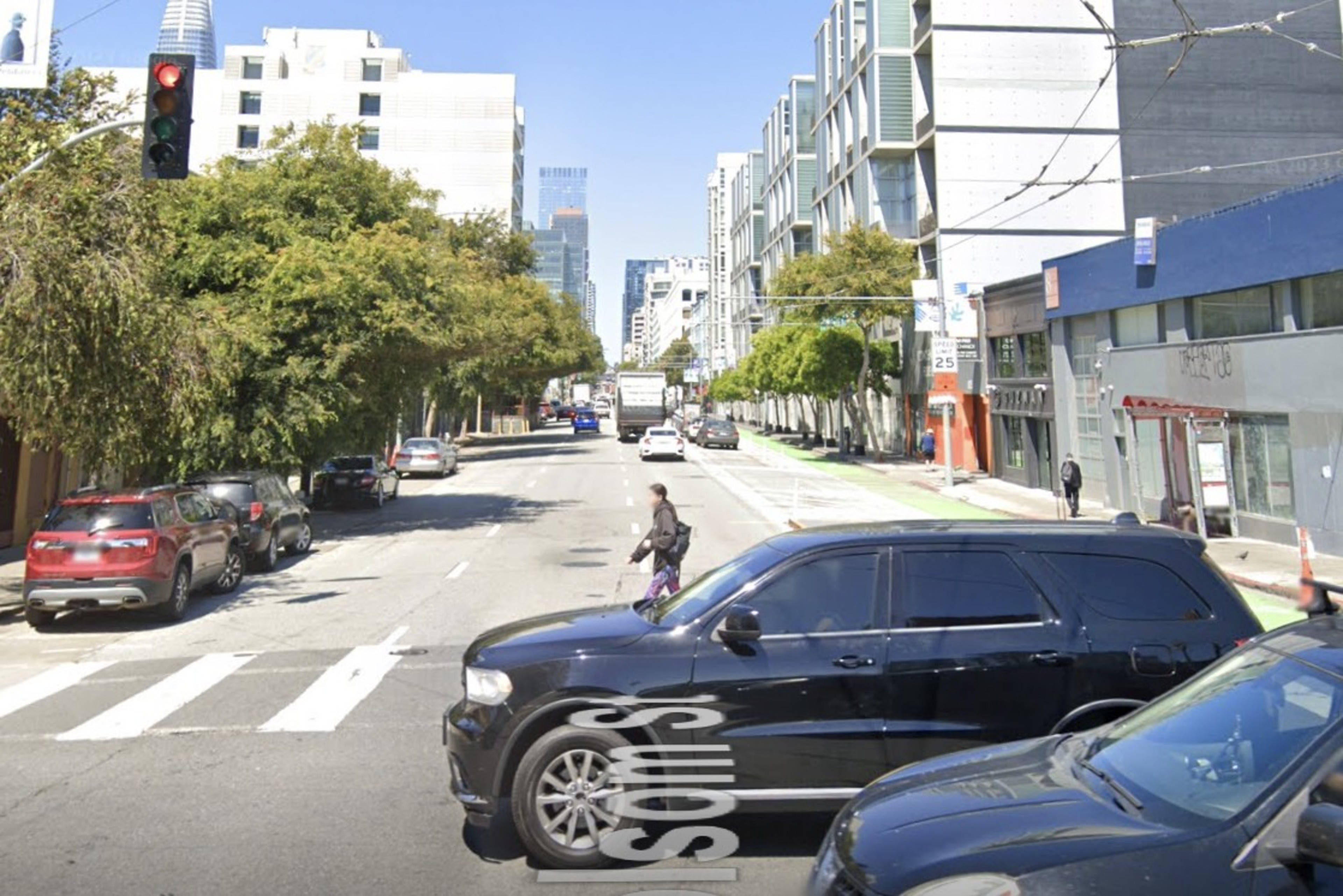 Cars drive over Fifth at Folsom St. in San Francisco