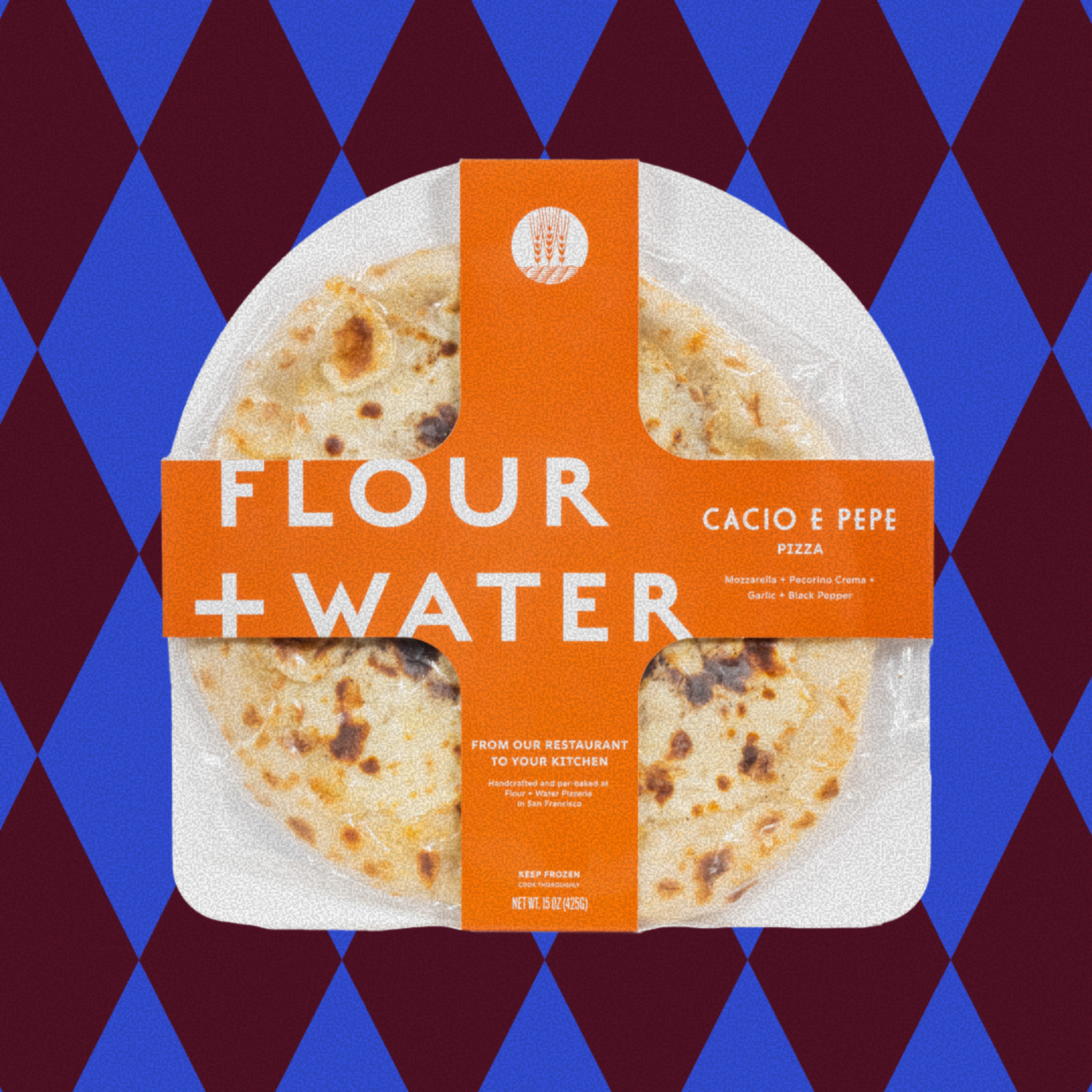 A packaged Cacio e Pepe pizza wrapped in orange labels reading "Flour + Water," listing mozzarella, pecorino crema, garlic, and black pepper as ingredients.