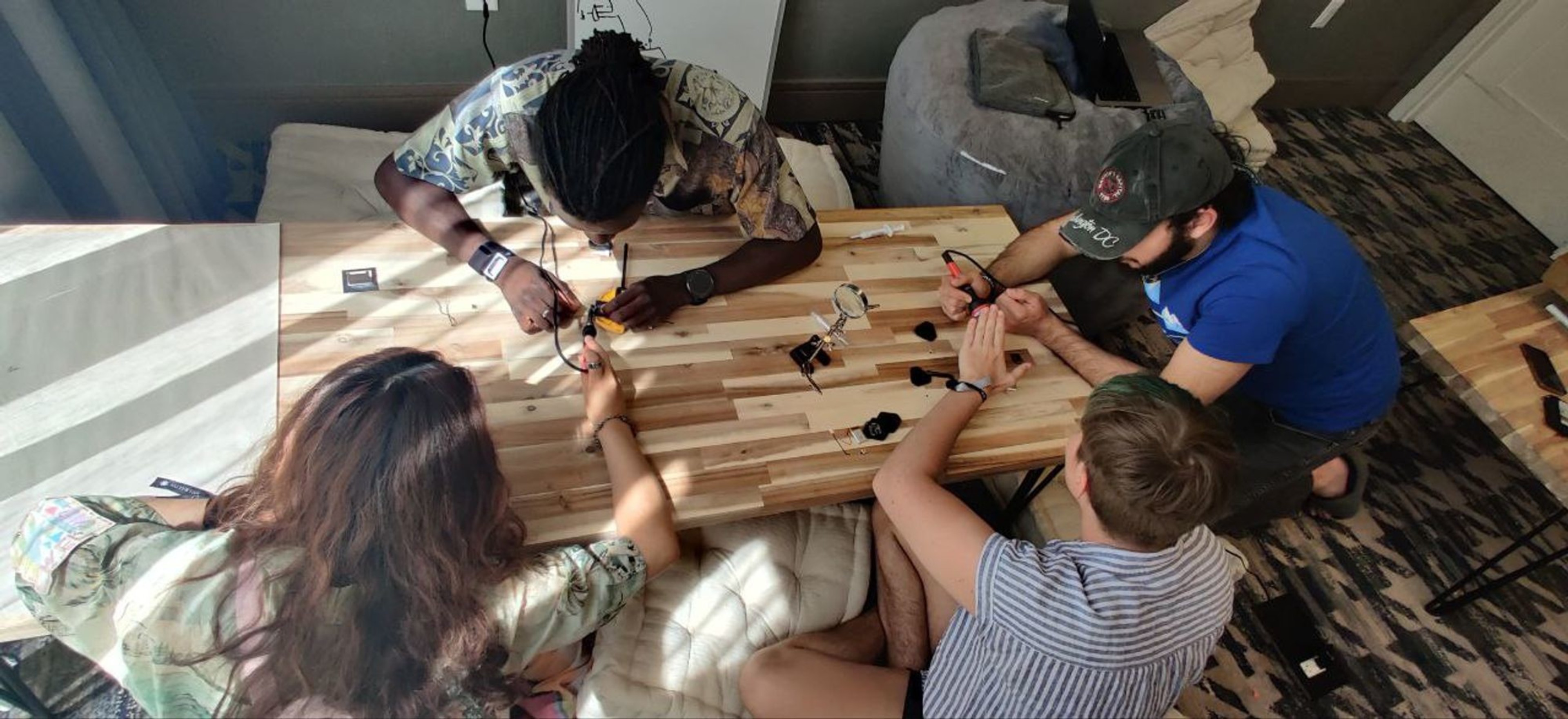 Samuel Gbafa, the CEO of TinyCloud, enjoyed building an AI wearable necklace, during a workshop at Edge Esmeralda.