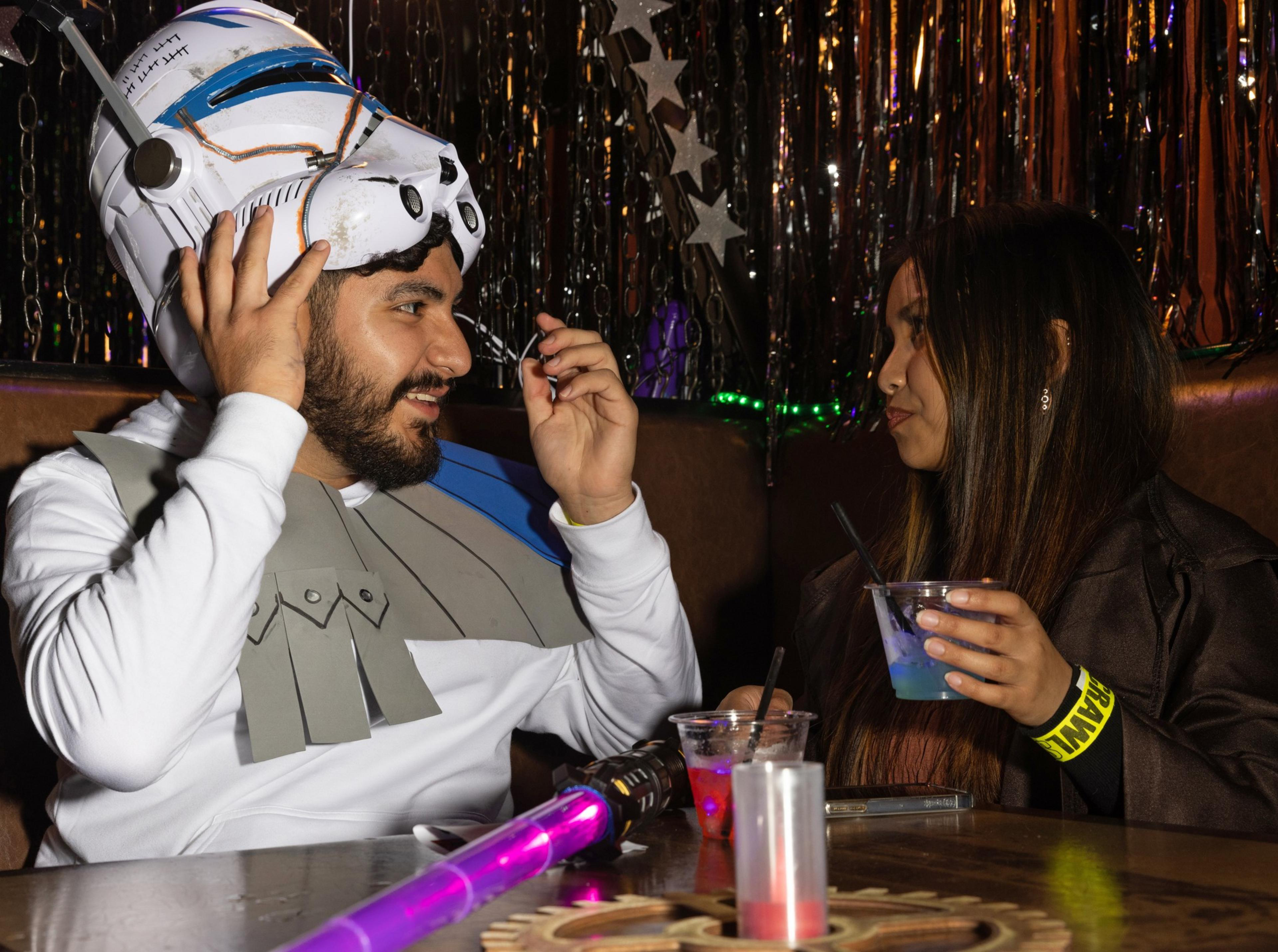 People drink inside a bar.