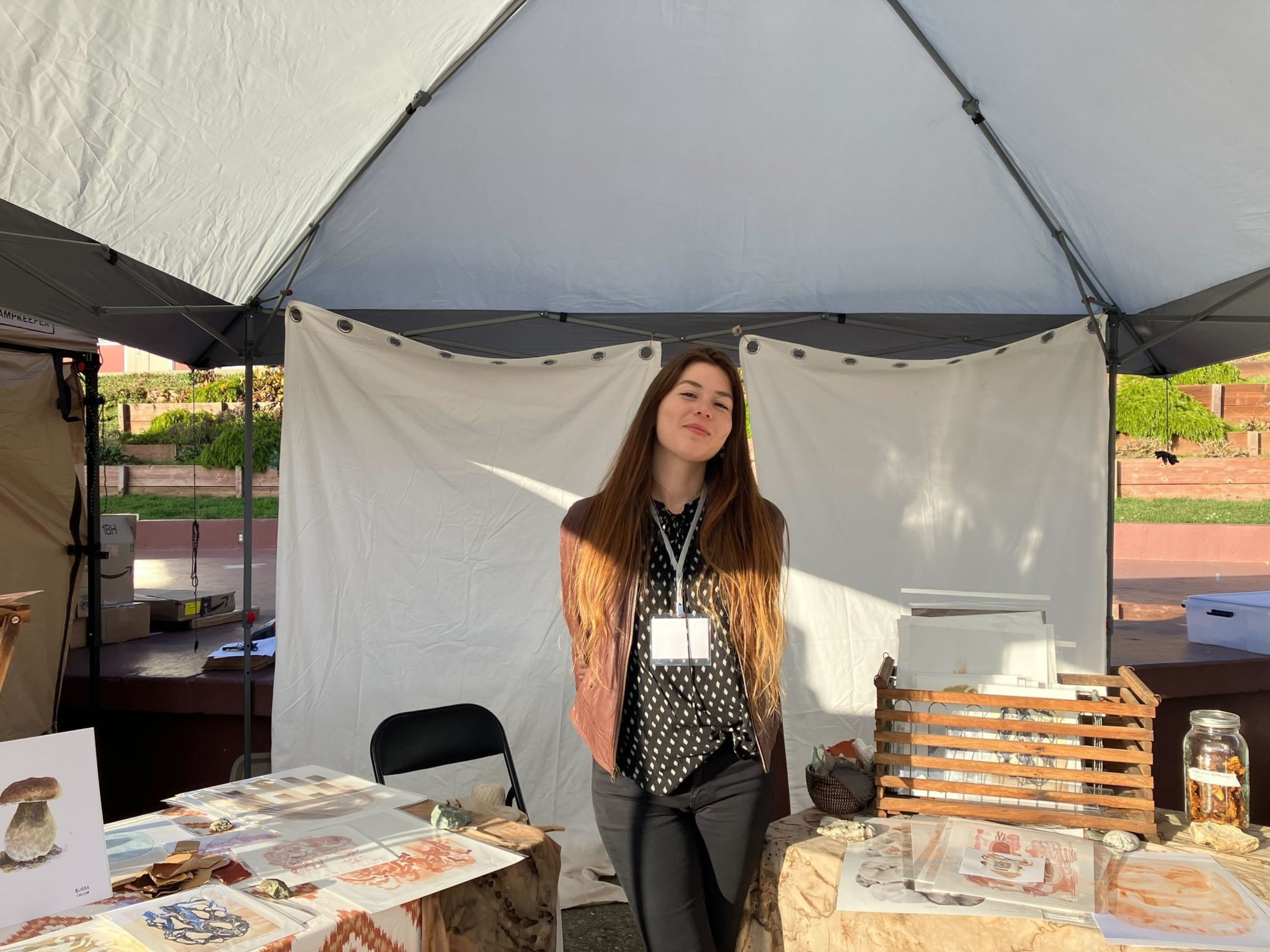 Elissa Callen poses with her fungus-based pigments and inks at the 51st annual Fungus Fair at El Camino High School in South San Francisco on Dec. 16, 2023.