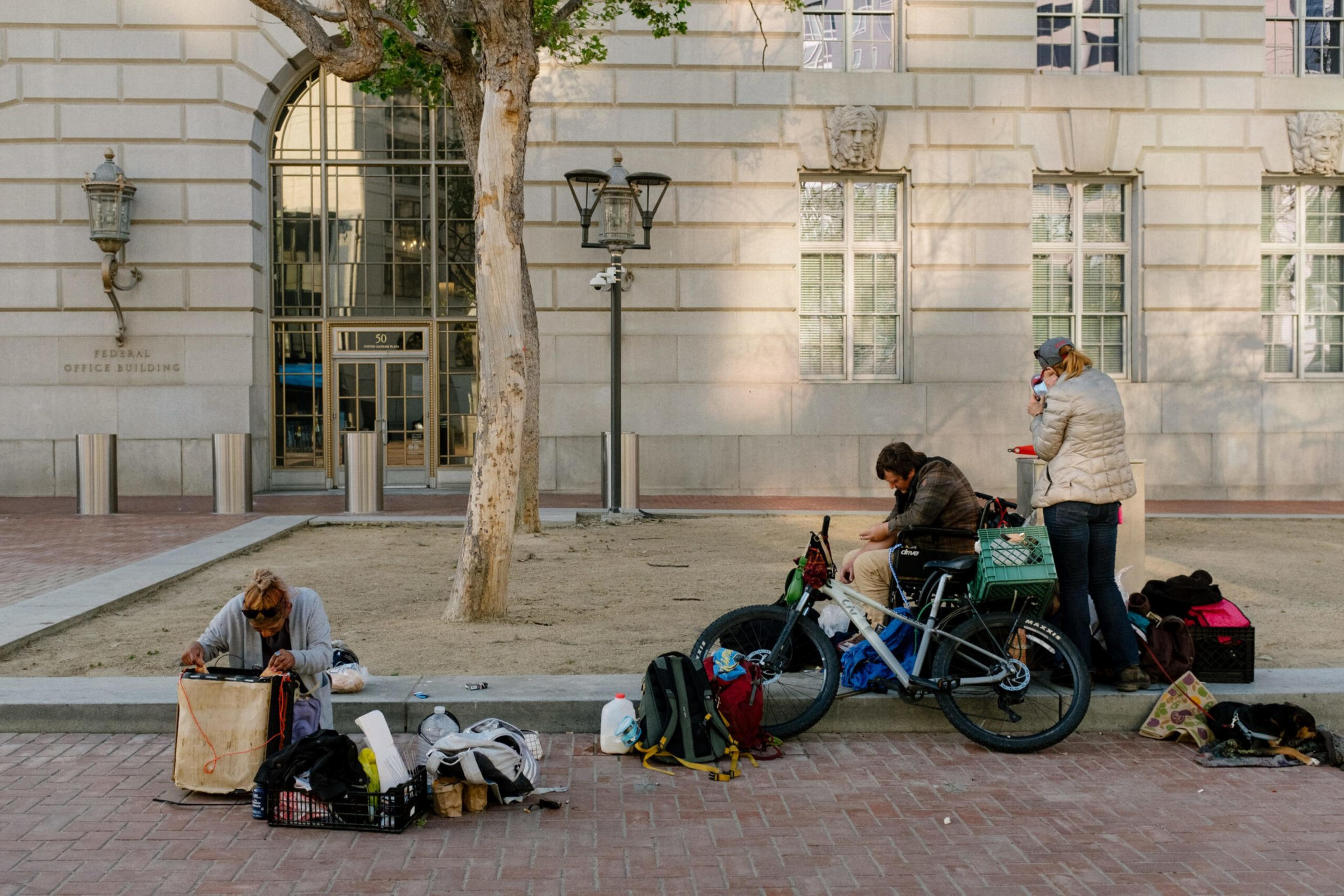 People gathered in UN Plaza with there belongings