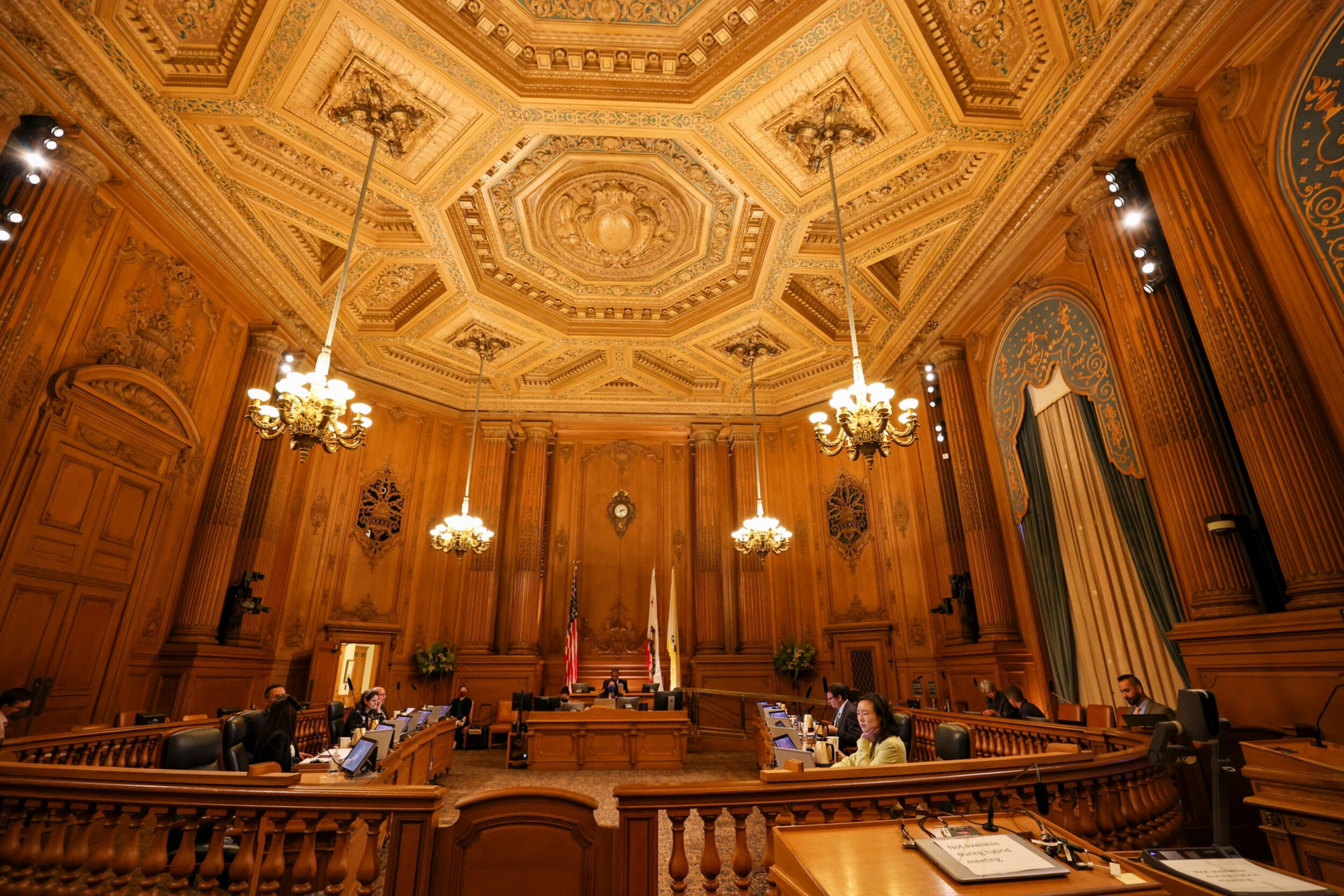 An ornate meeting room with high ceilings.