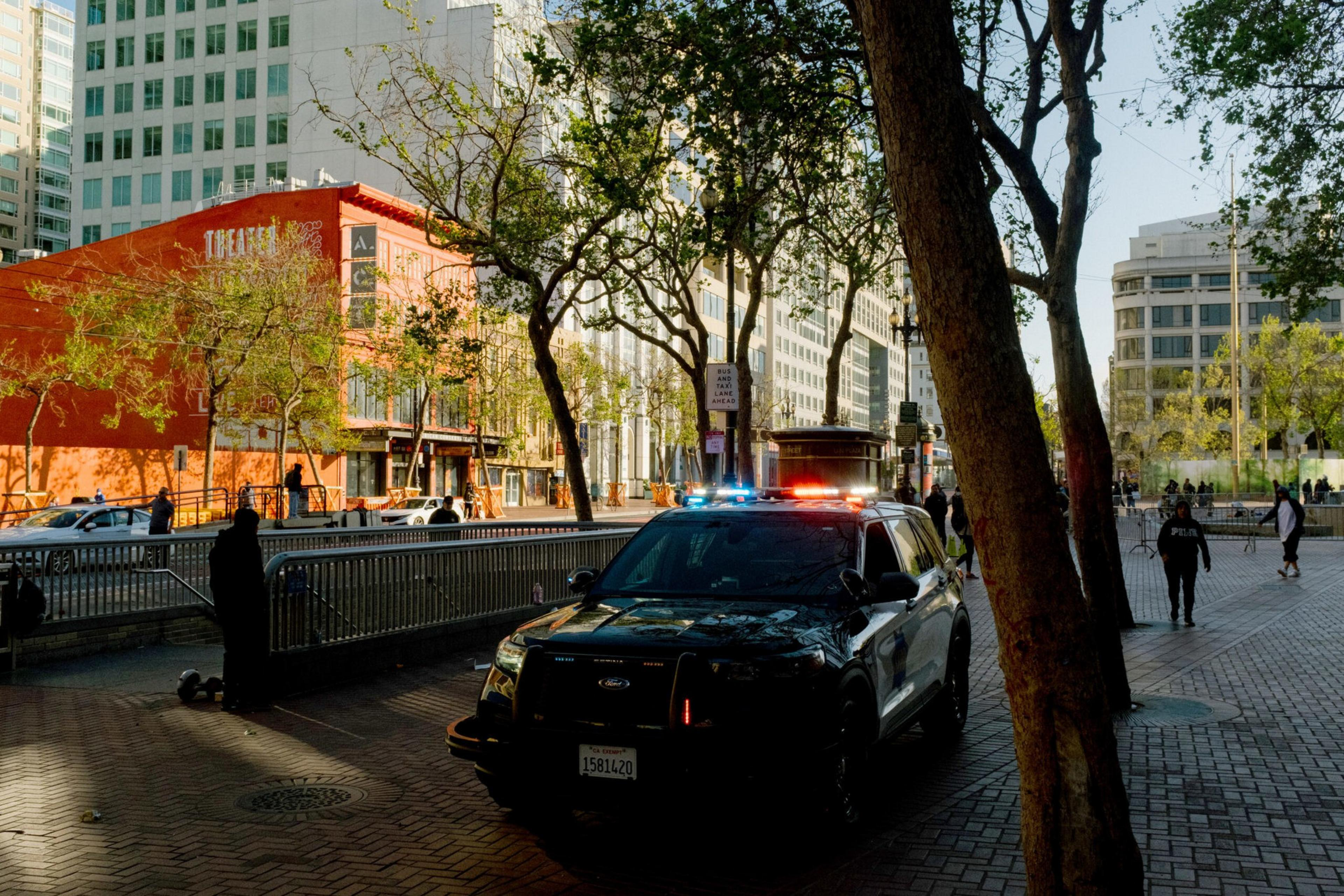 An SFPD vehicle patrols United Nations Plaza in San Francisco on May 11. | Jason Henry for The Standard