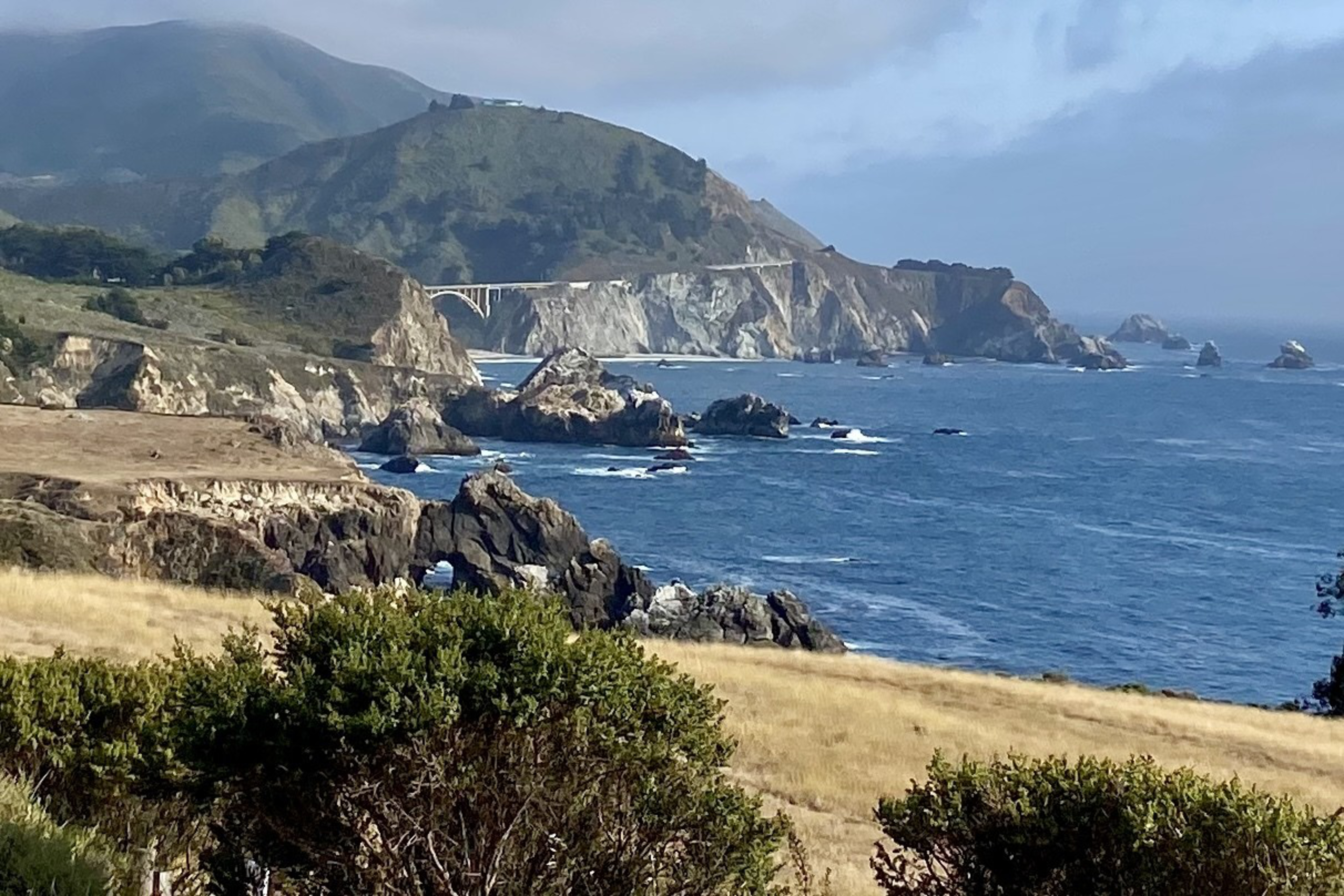 Cliffs of the California coastline with the Pacific Ocean on the right.