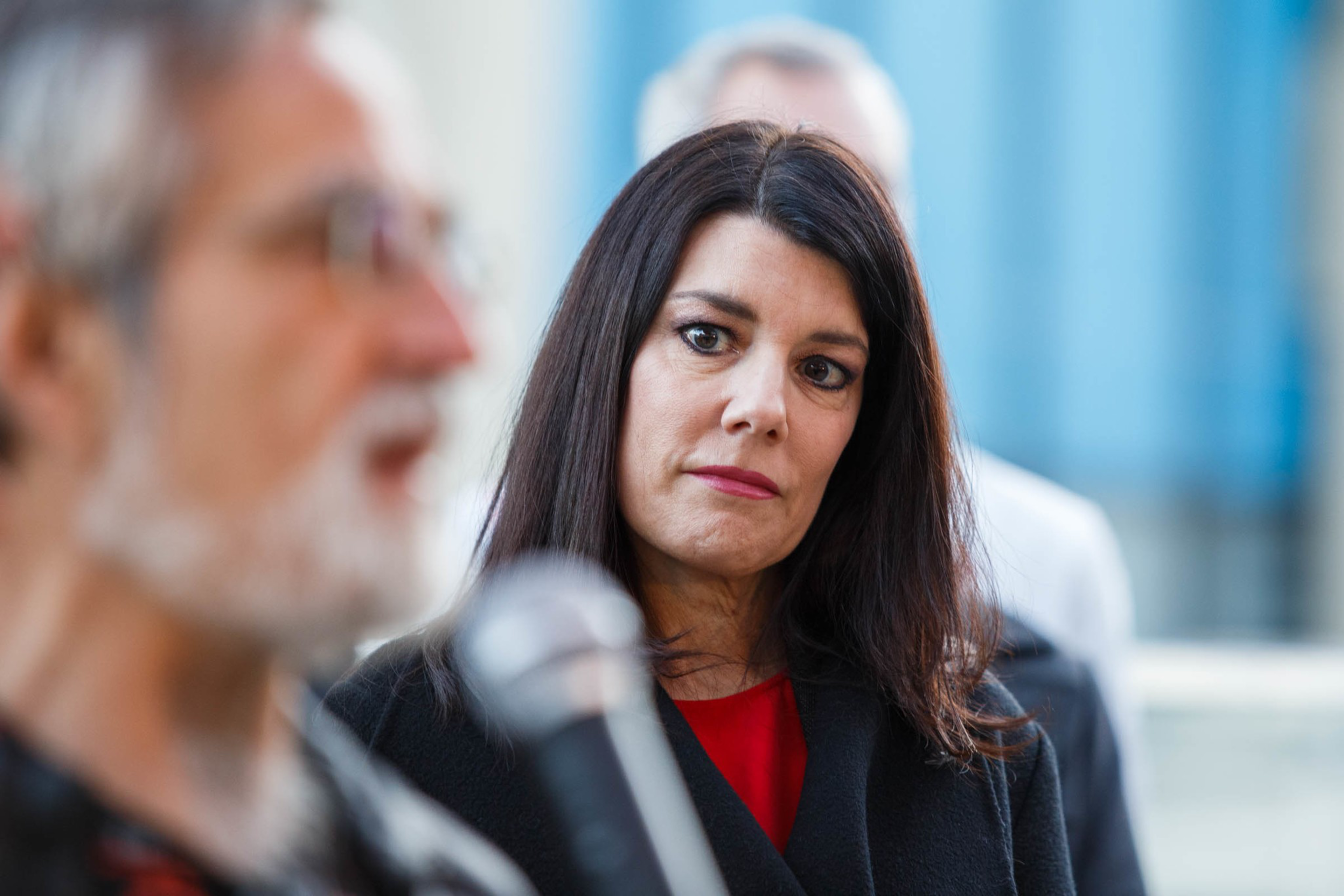 Supervisor Catherine Stefani listens during a press conference.