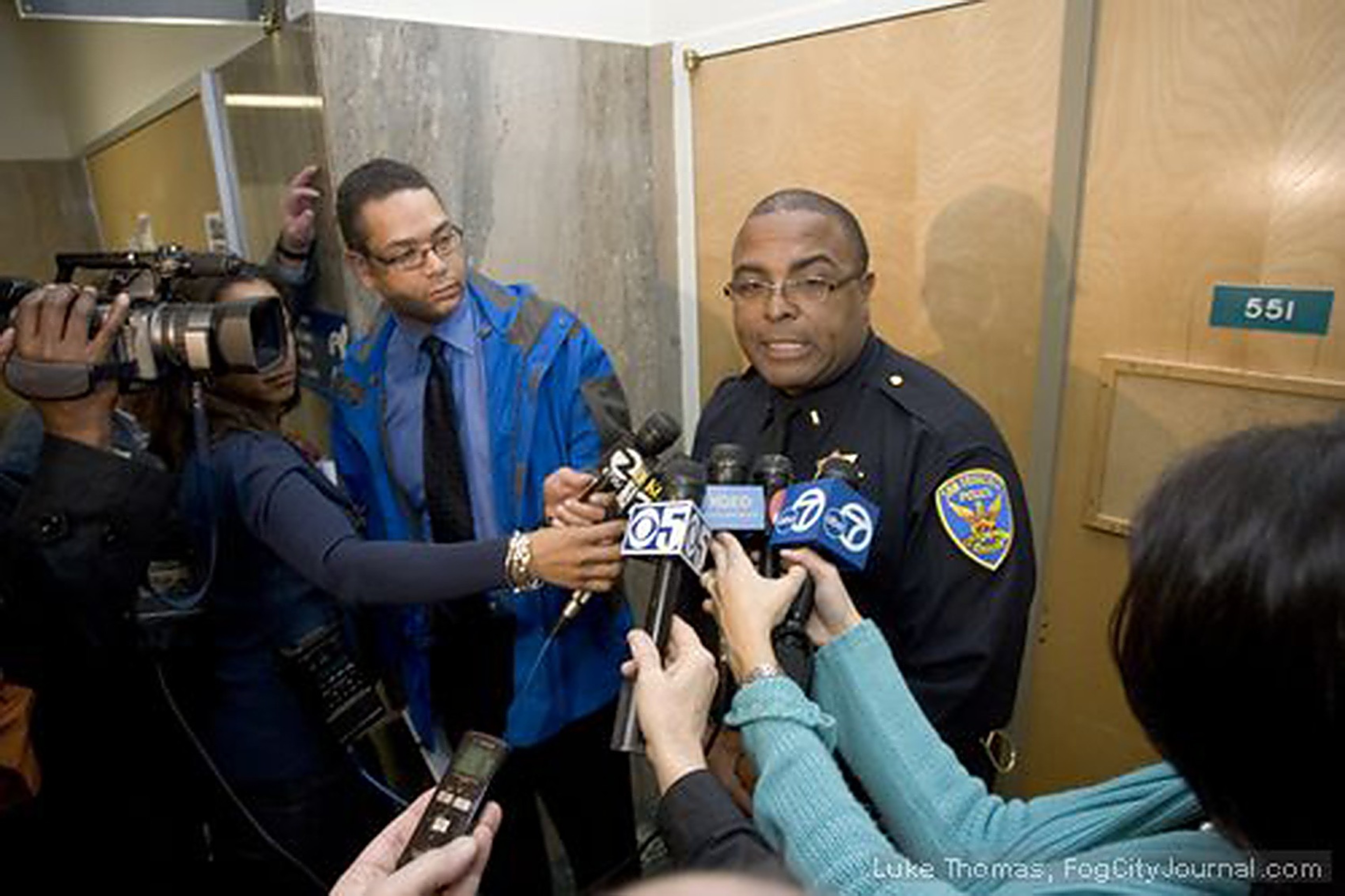A police officer at a press event. 