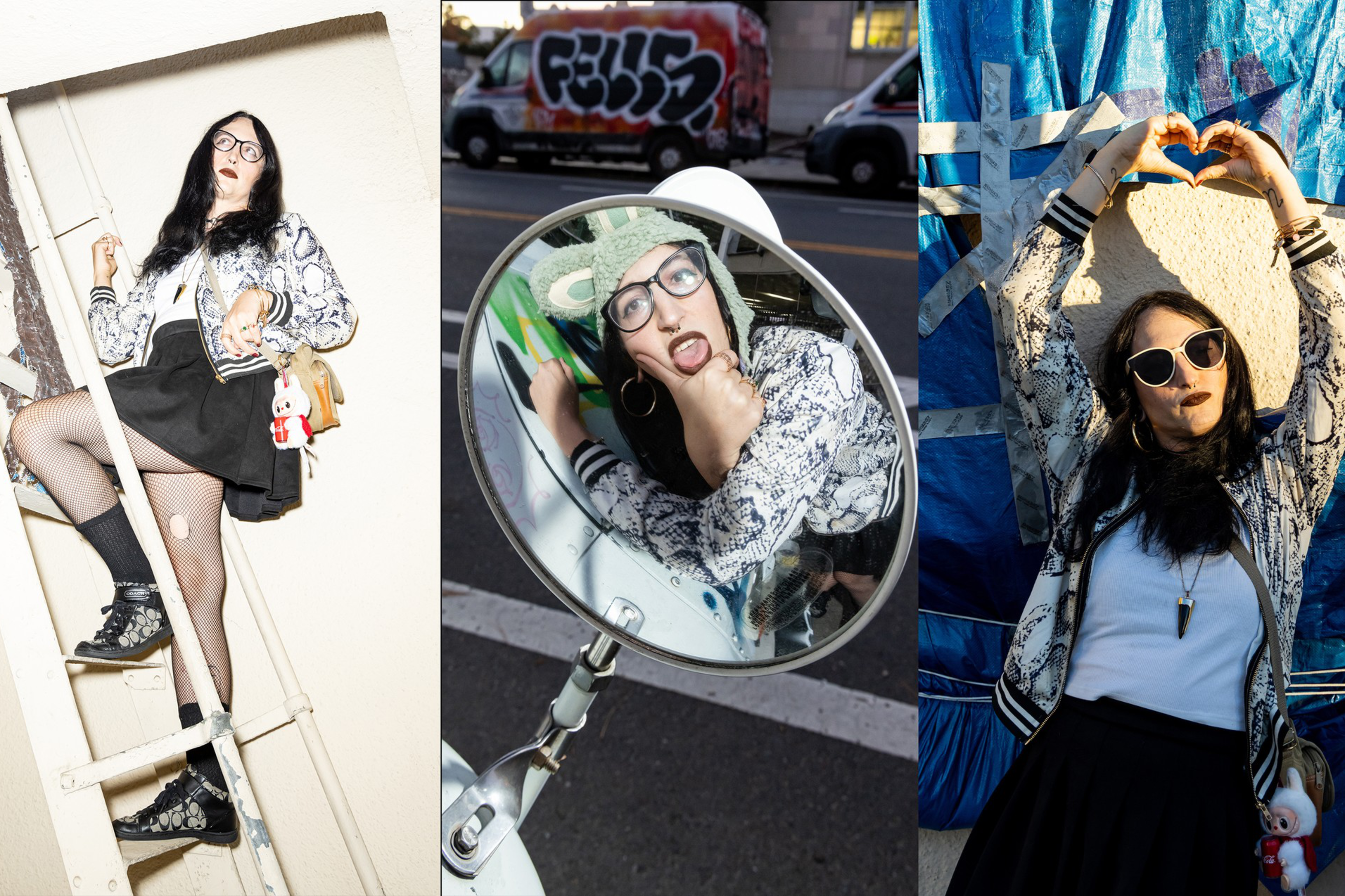 A woman with long dark hair wears a patterned jacket, black skirt, and glasses, posing on a ladder, making a face in a mirror, and forming a heart with her hands.