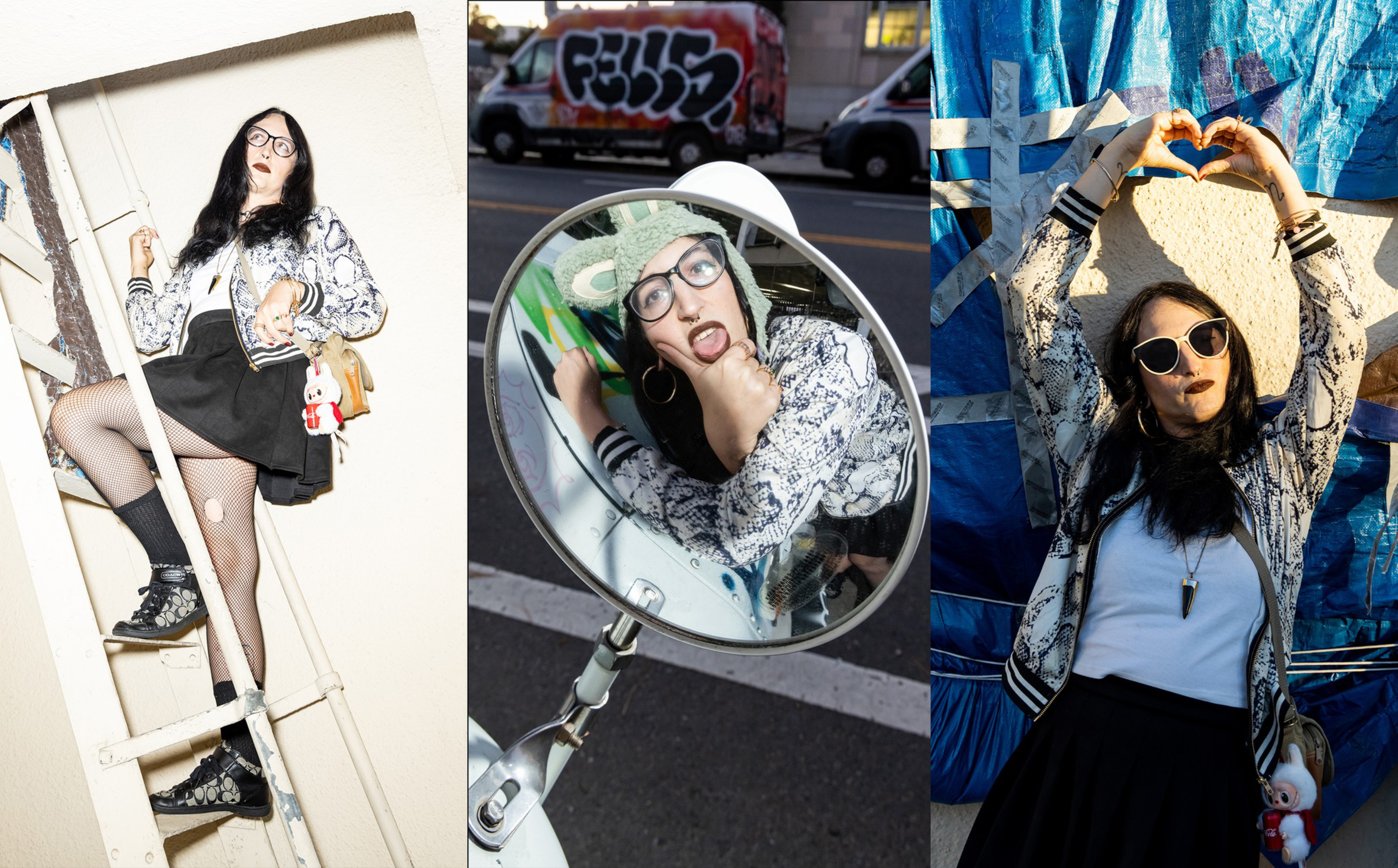 A woman with long dark hair wears a patterned jacket, black skirt, and glasses, posing on a ladder, making a face in a mirror, and forming a heart with her hands.