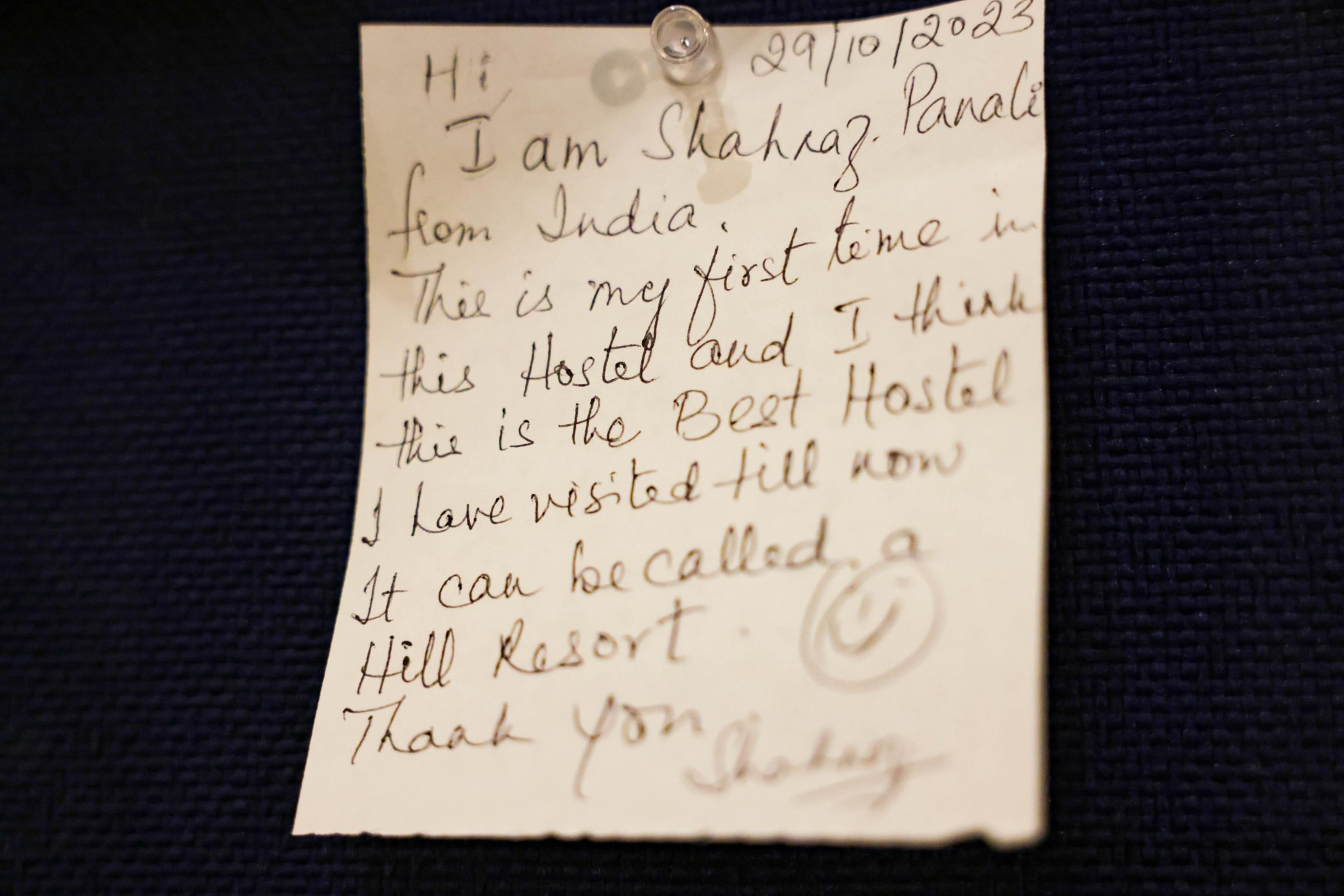 A person note that is pinned on the wall. 