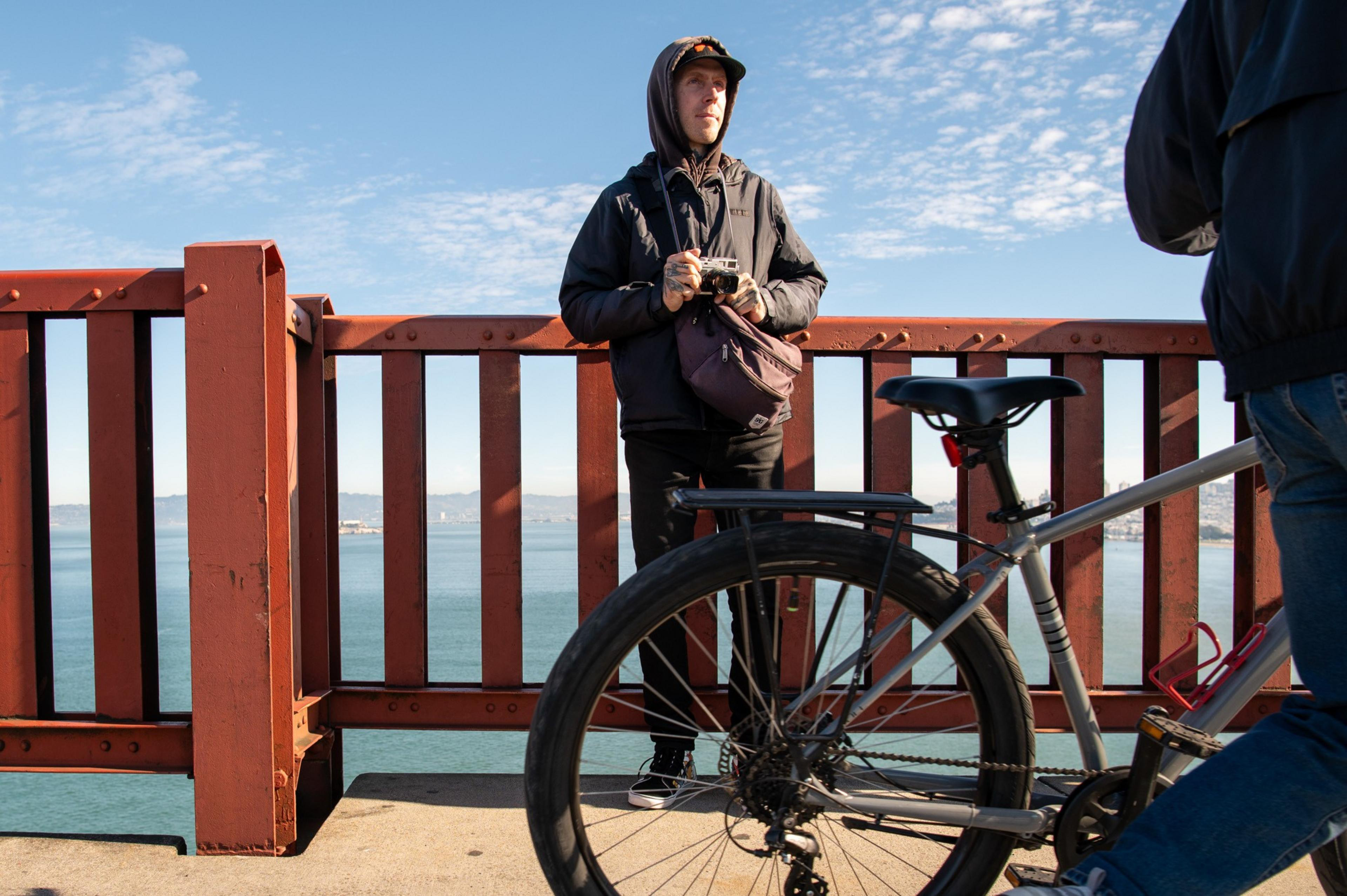 Jake Ricker stands on the pedestrian walkway of the bridge on Dec. 12.
