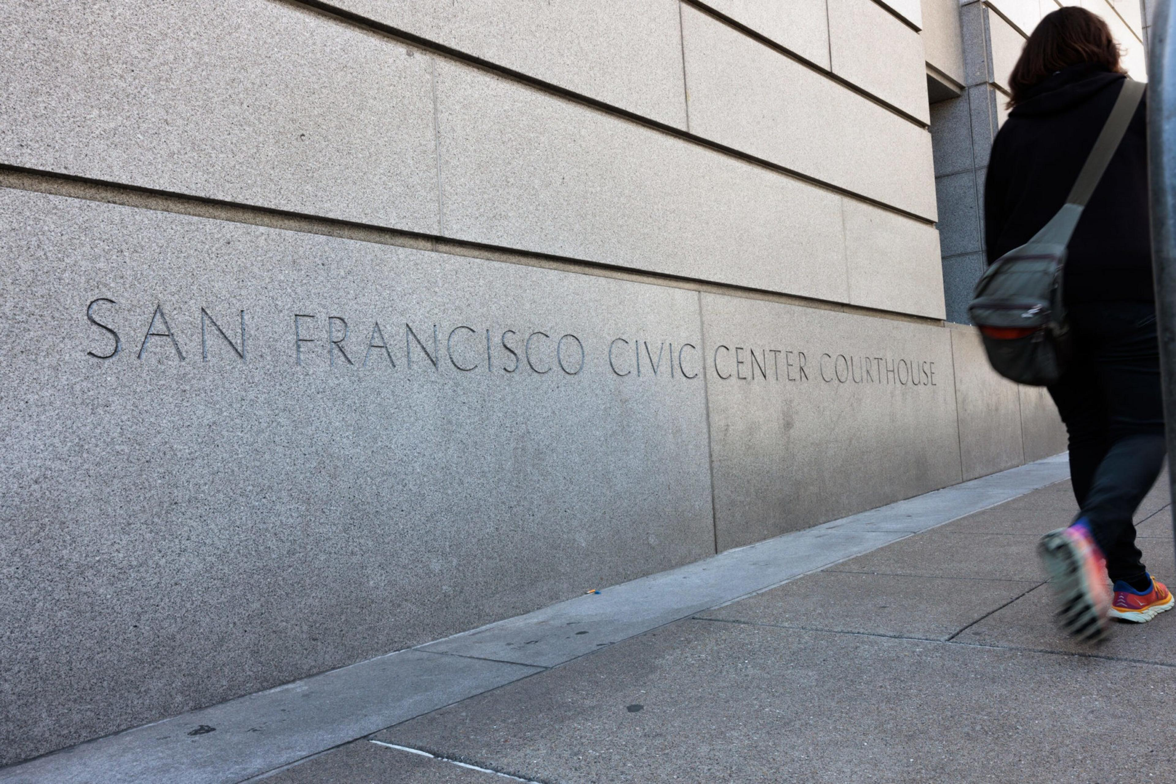 A gray building with the words San Francisco Civic Center Courthouse