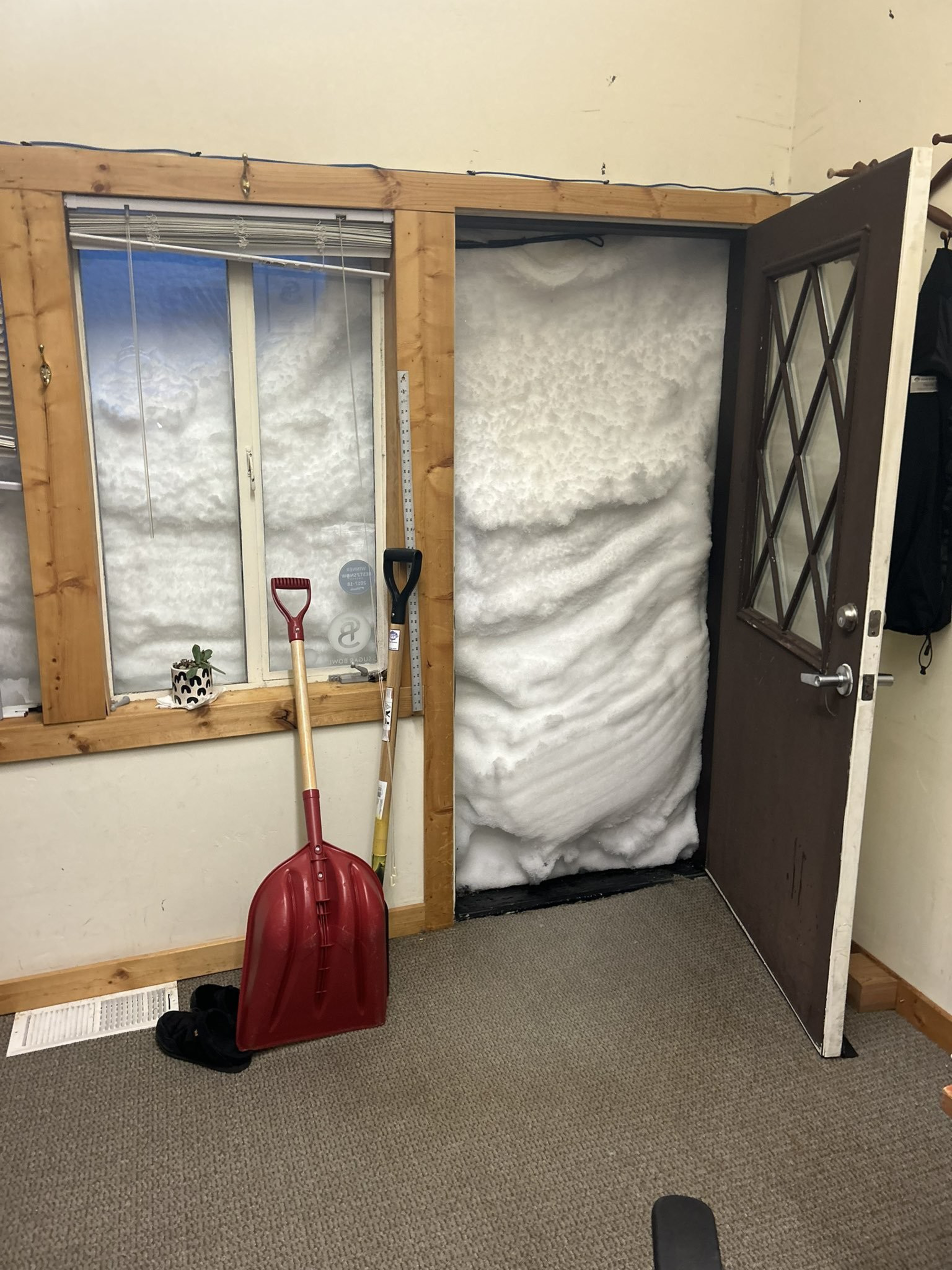Snow blocks front door