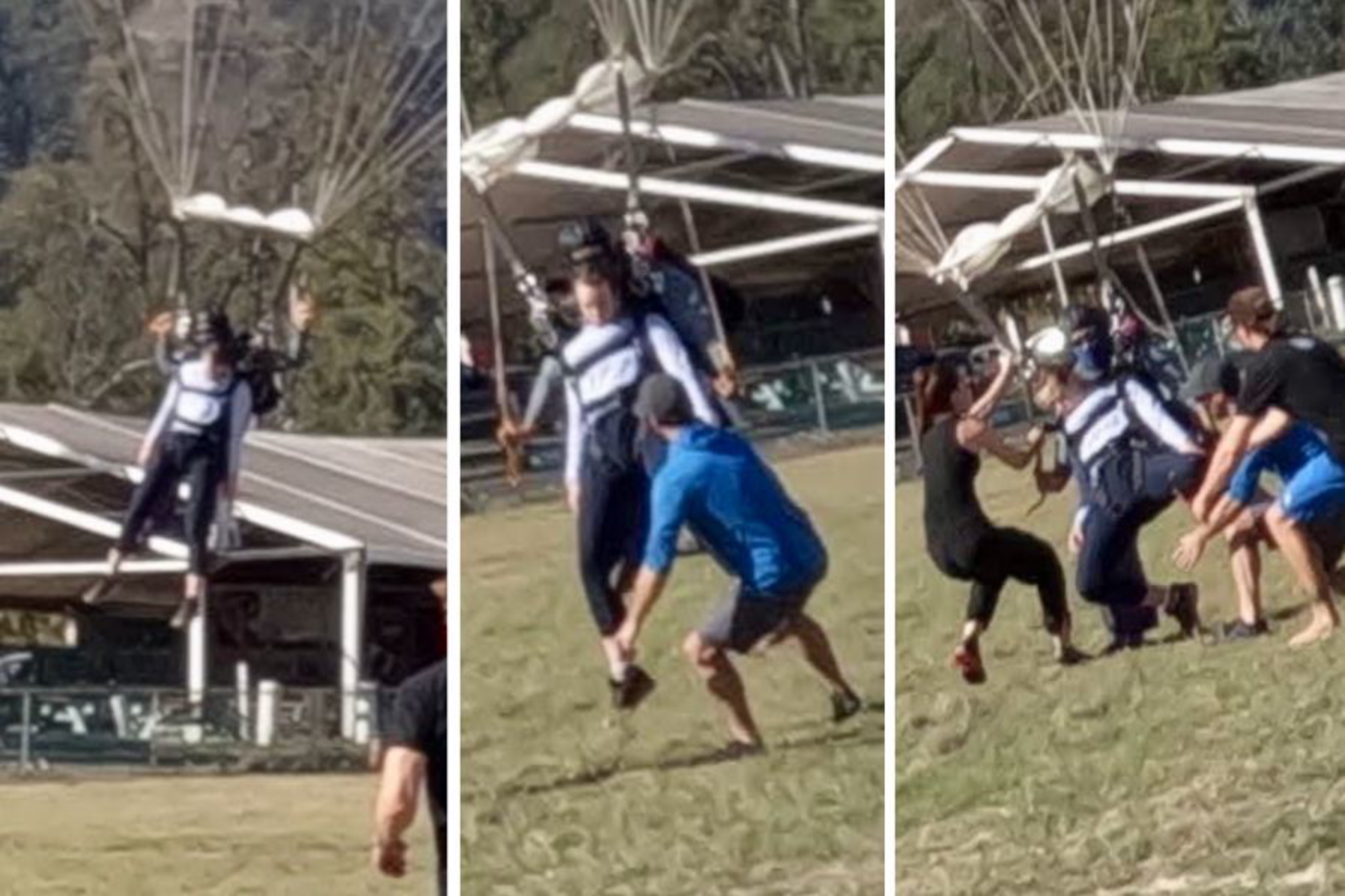 A woman lands on the ground wearing a parachute.