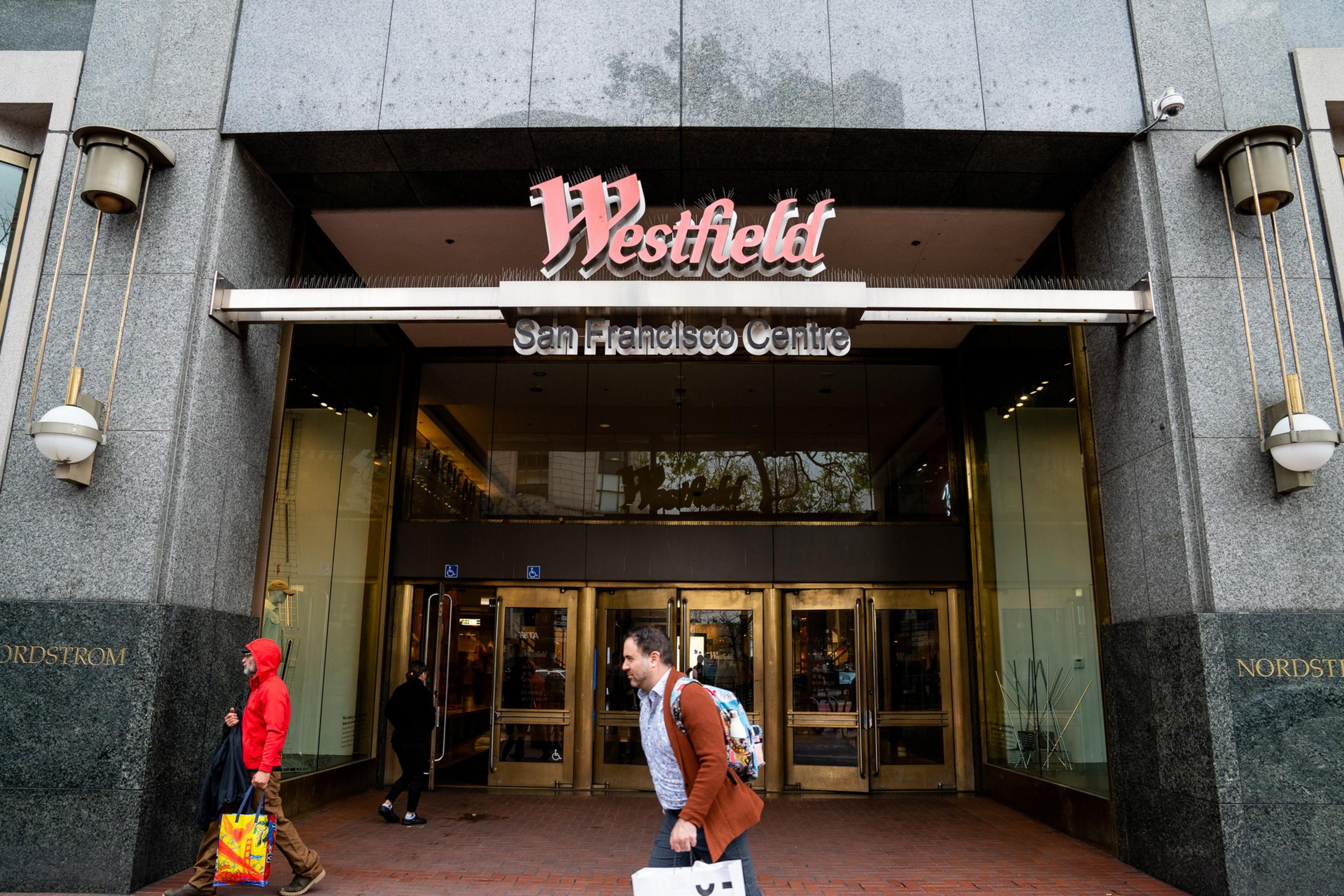 Pedestrians pass Westfield San Francisco Centre on Market Street in Downtown San Francisco on May 3, 2023. | Justin Katigbak for The Standard