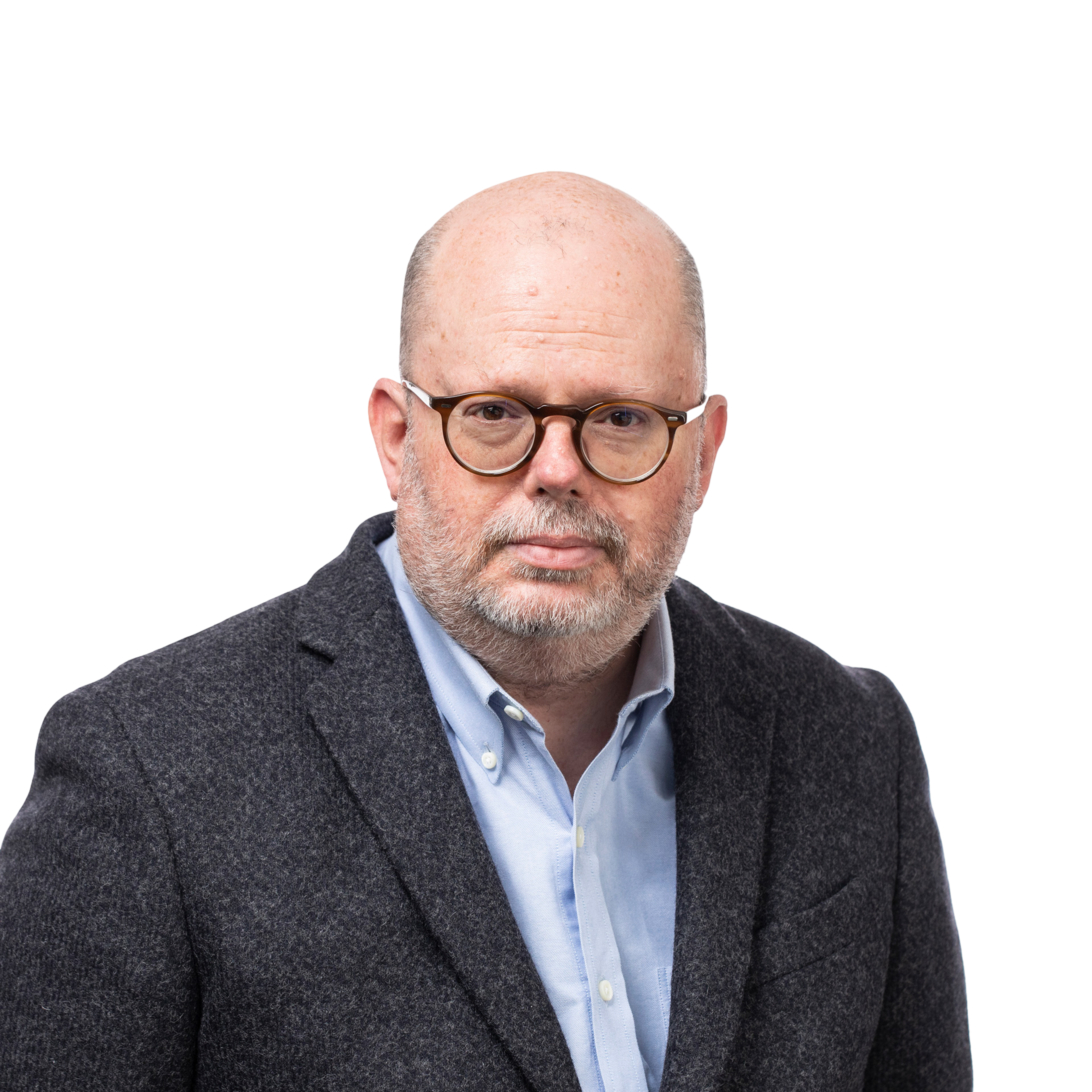 A middle-aged man with a bald head, glasses, and a trimmed beard wears a light blue shirt under a dark gray blazer, looking seriously at the camera.
