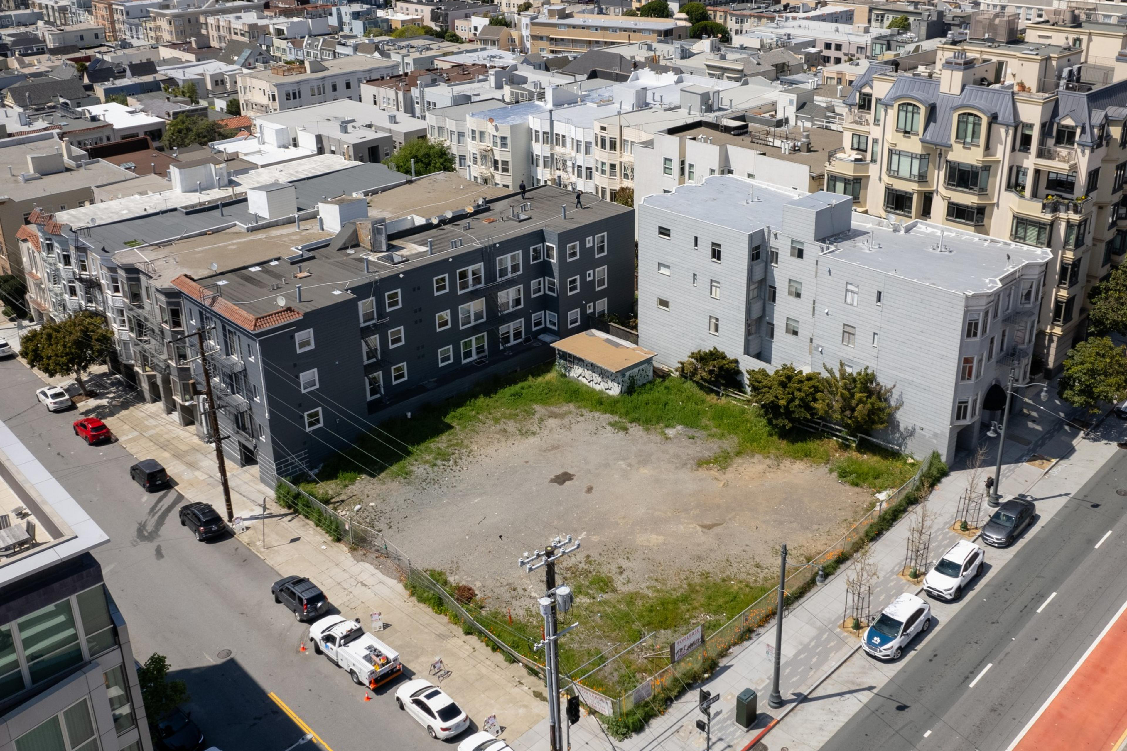 An empty plot of land is seen in an aerial photo.