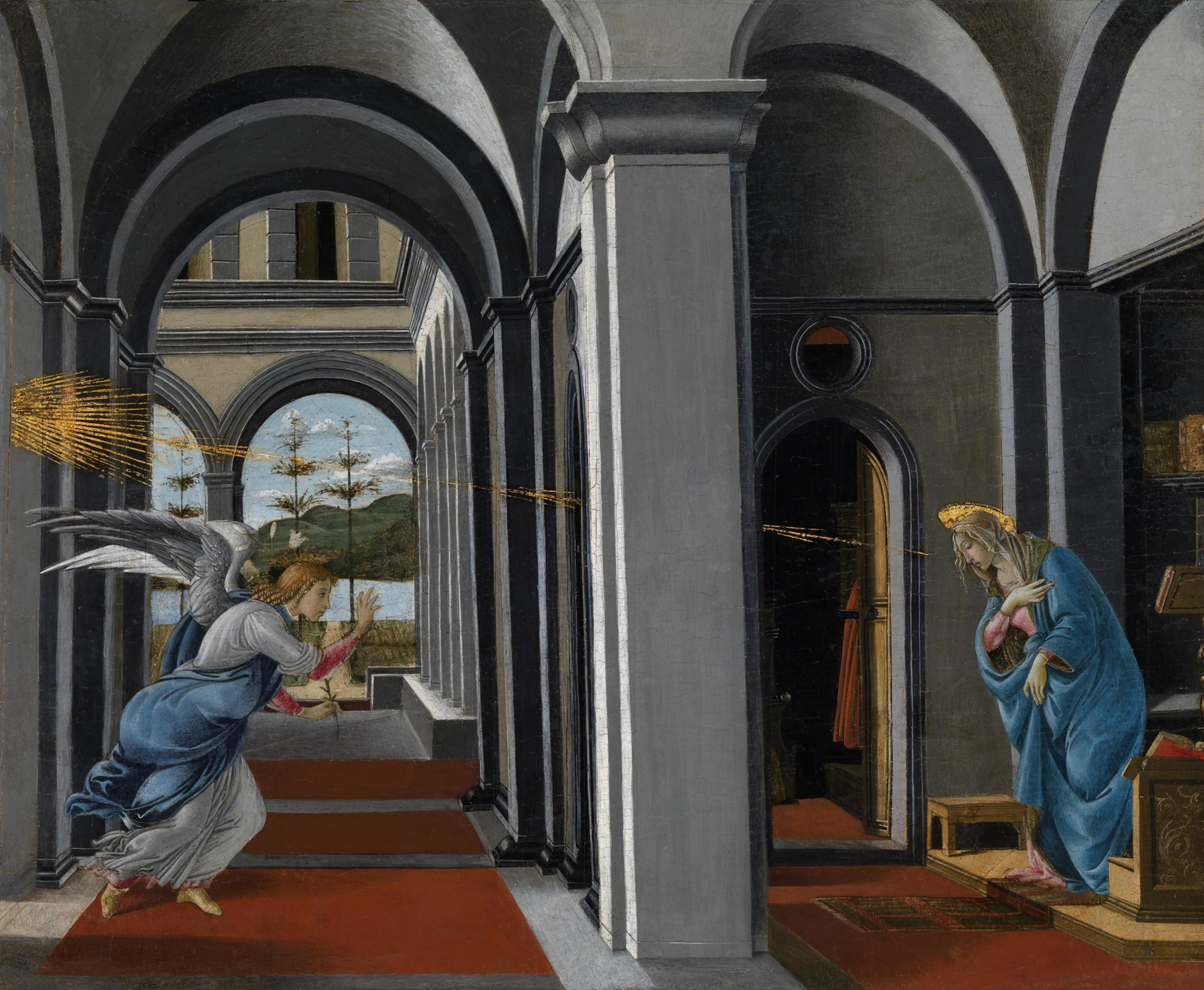 A Renaissance oil painting depicts an angel in a corridor with rays of light shining towards the figure of the Virgin Mary.