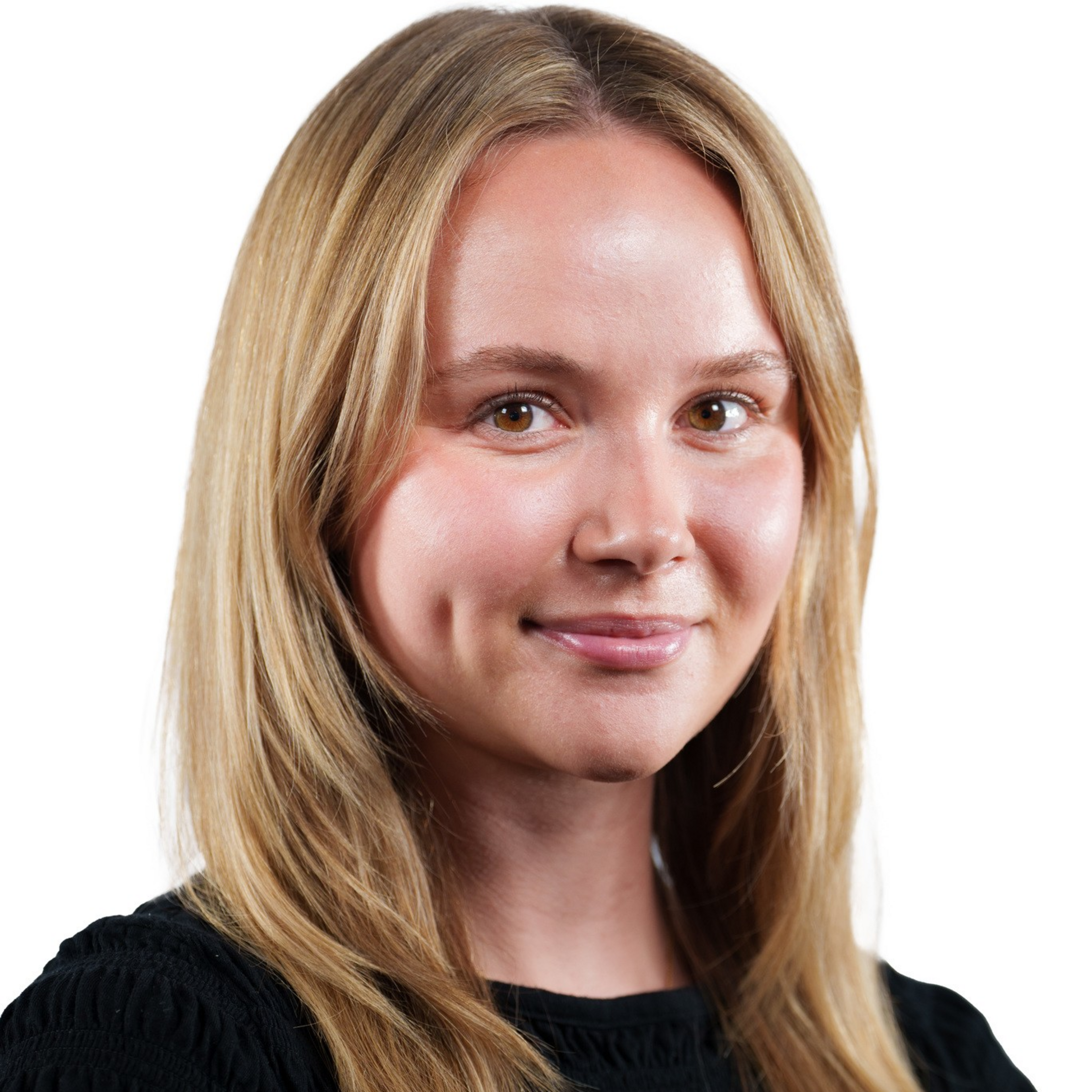 A woman with long blonde hair and brown eyes smiles softly, wearing a black textured top against a plain white background.